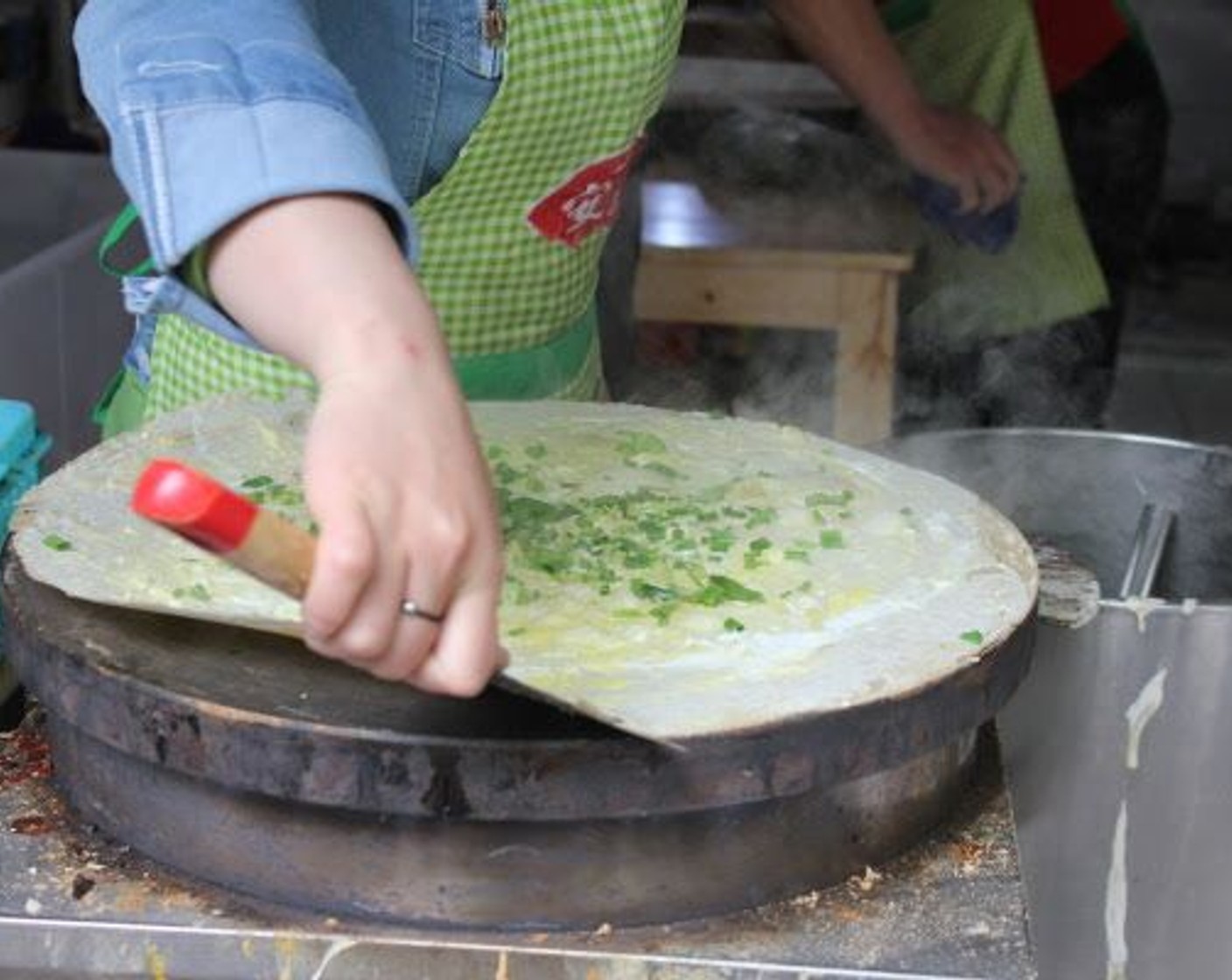 step 6 Scrap under the pancake as it sets with a metal spatula (a putty knife works great here) so it doesn’t stick.