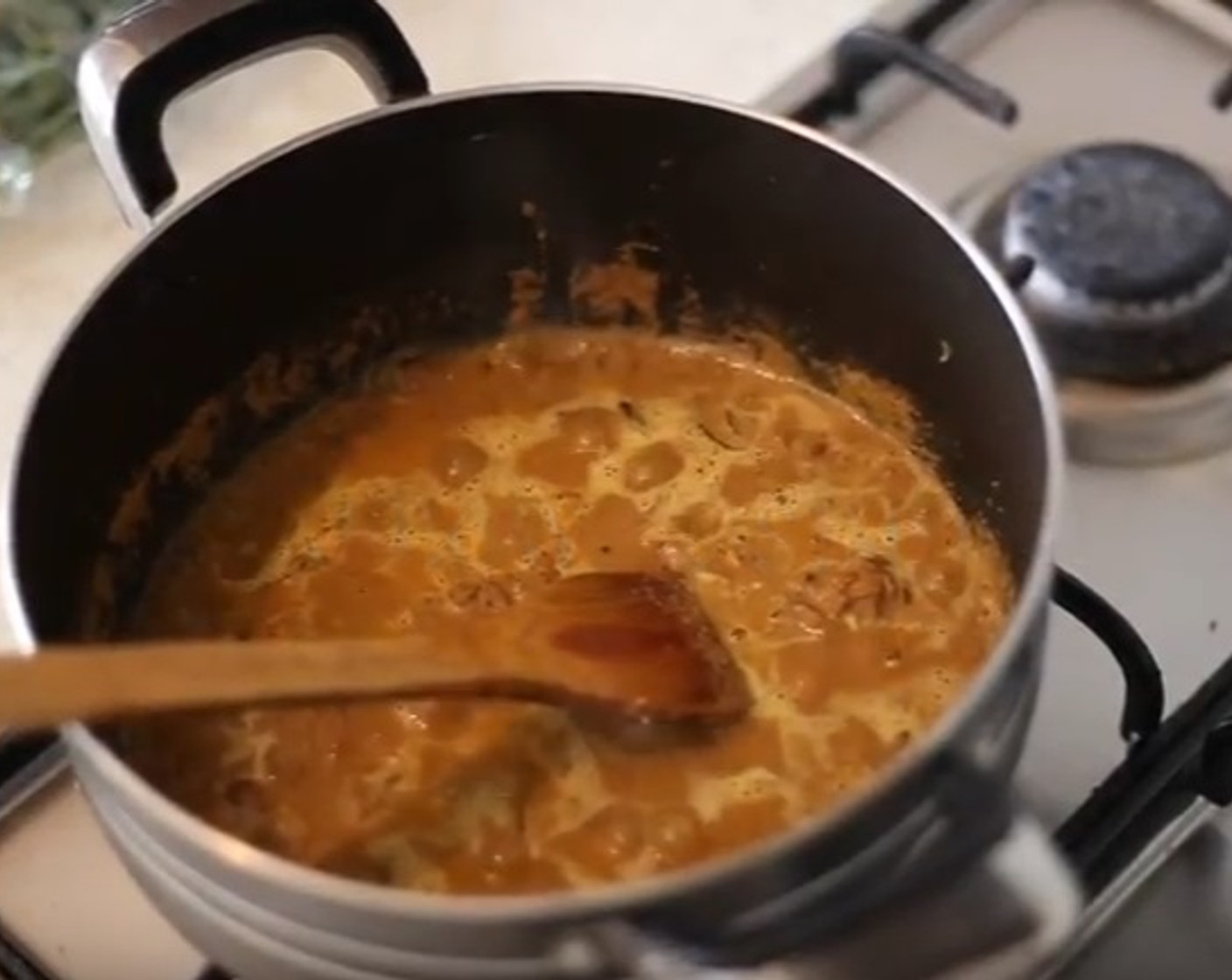 step 7 Add the Ground Coriander (1/3 cup), Red Chili Powder (2 tsp), Garam Masala (1 tsp), and the yogurt paste mix. Saute for a while and add Water (3/4 cup). Allow to Simmer