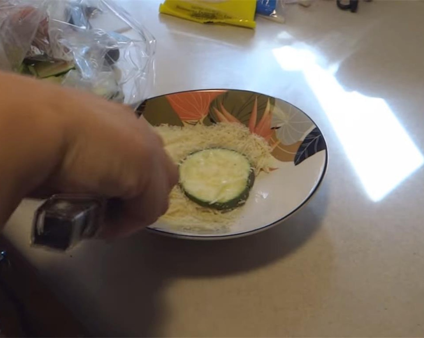 step 5 Place zucchini rounds in the bread crumb mixture, coating both sides, and pressing the mixture onto the rounds.