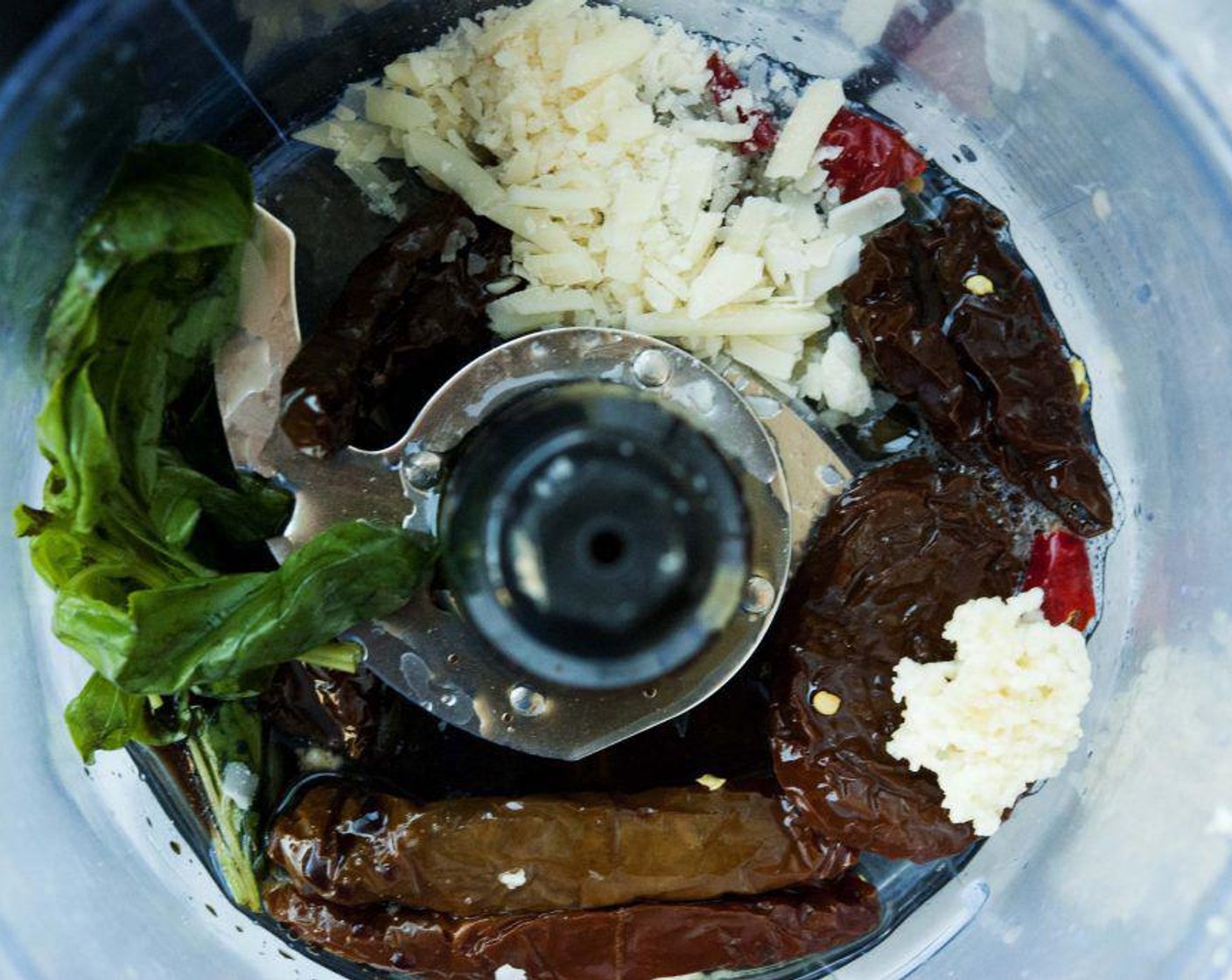 step 8 Place Sun-Dried Tomatoes in Olive Oil (5), Garlic (1 clove), lemon juice and zest, Balsamic Vinegar (1/2 Tbsp), Fresh Basil Leaves (4), and parmesan cheese into a food processor.