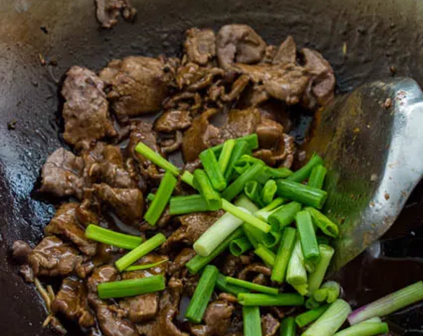 step 9 Add Scallion (1/2 cup) to the wok at the last minute. Give all the ingredients a good stir, then transfer the dish to a serving plate.