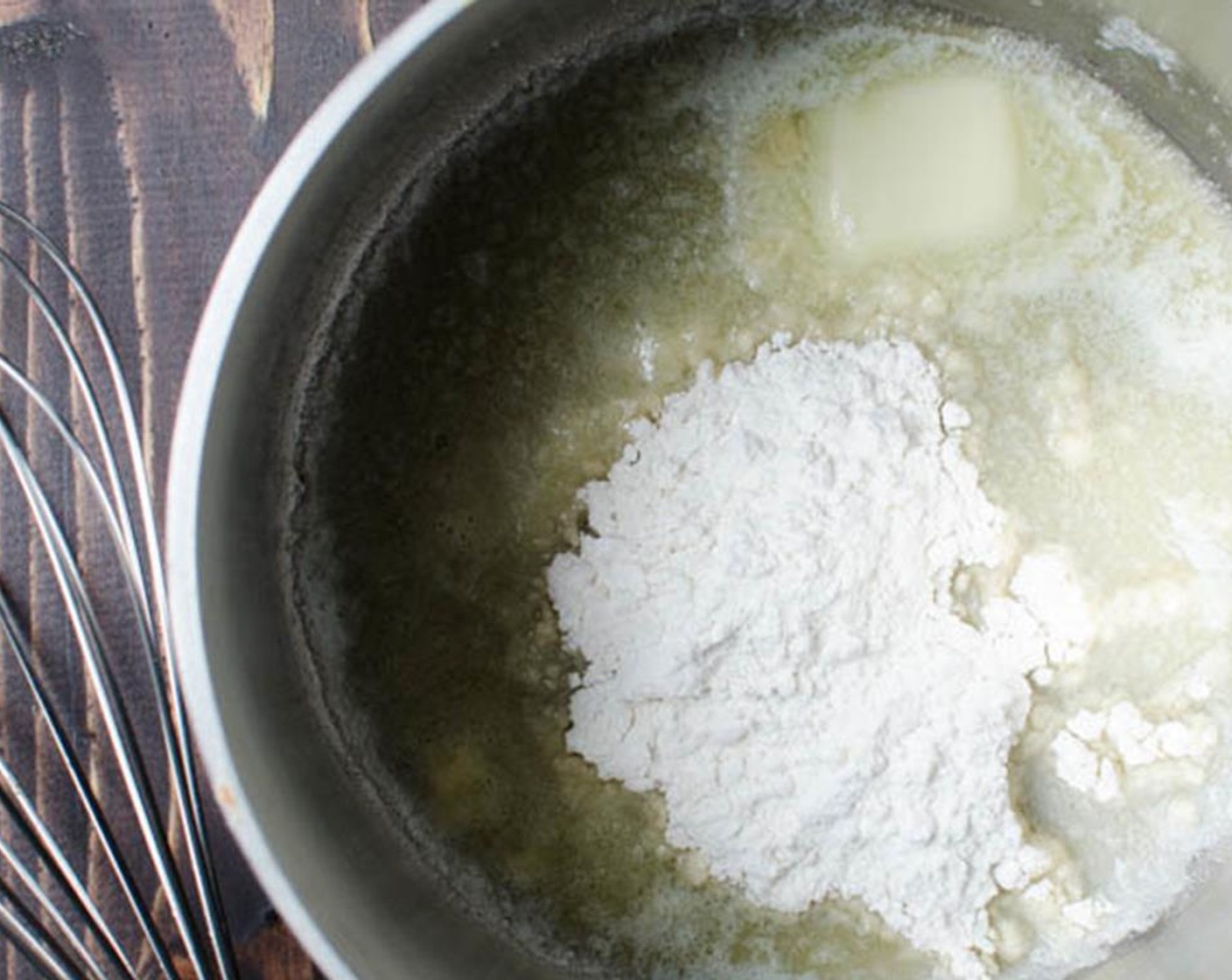 step 7 In a large saucepan, melt Butter (3 Tbsp) Add the All-Purpose Flour (3 Tbsp) and cook, whisking constantly to combine. Stir in Salt (1/2 tsp), Ground Black Pepper (1/4 tsp) and Cayenne Pepper (1/4 tsp). When the roux begins to bubble, cook for one minute.