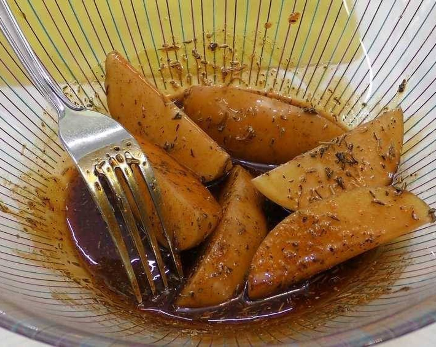 step 3 Clean the Potatoes (8) without removing the skin and cut into wedges. Add into the bowl and toss until thoroughly coated in the oil and spices.