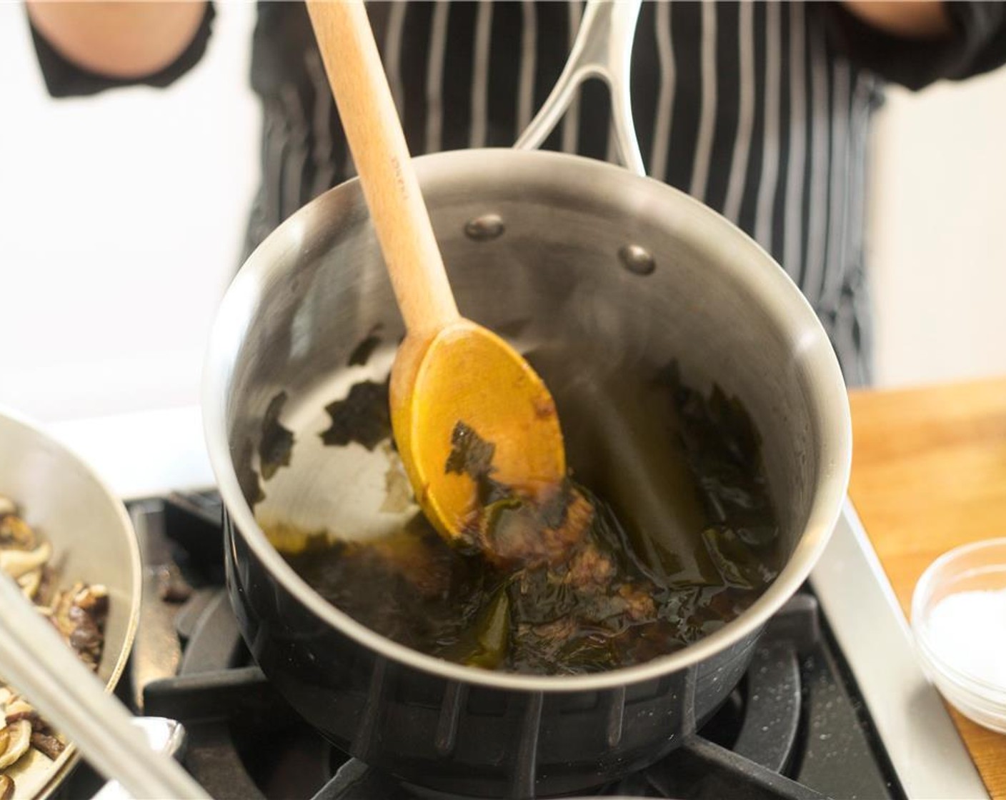 step 12 Stir in Bonito Flakes (1 1/2 cups), Seaweed (1/4 cup), Kombu (1 piece), ginger , shallot, Garlic (1 clove), Rice Vinegar (1/4 cup), Tamari Soy Sauce (2 Tbsp), and Mirin (1 Tbsp). Simmer for 10 minutes.