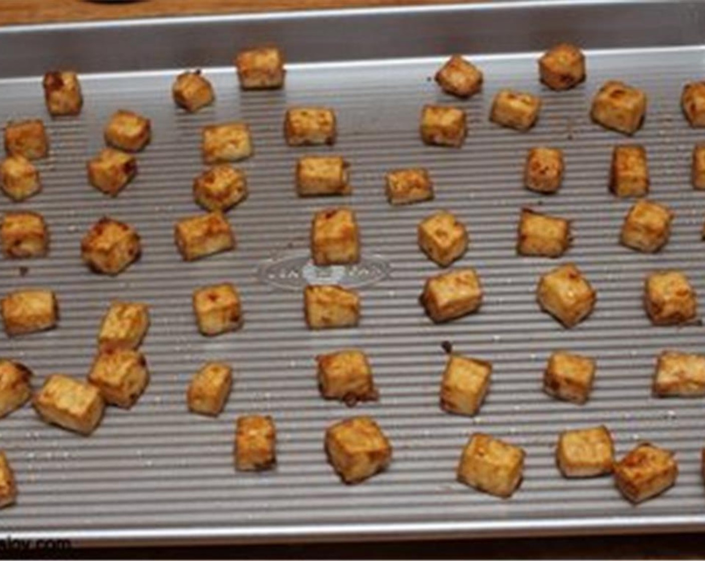 step 4 Place tofu on a baking sheet and bake in the preheated 350 degrees F (180 degrees C) oven for about 30 to 40 minutes turning once in the middle.