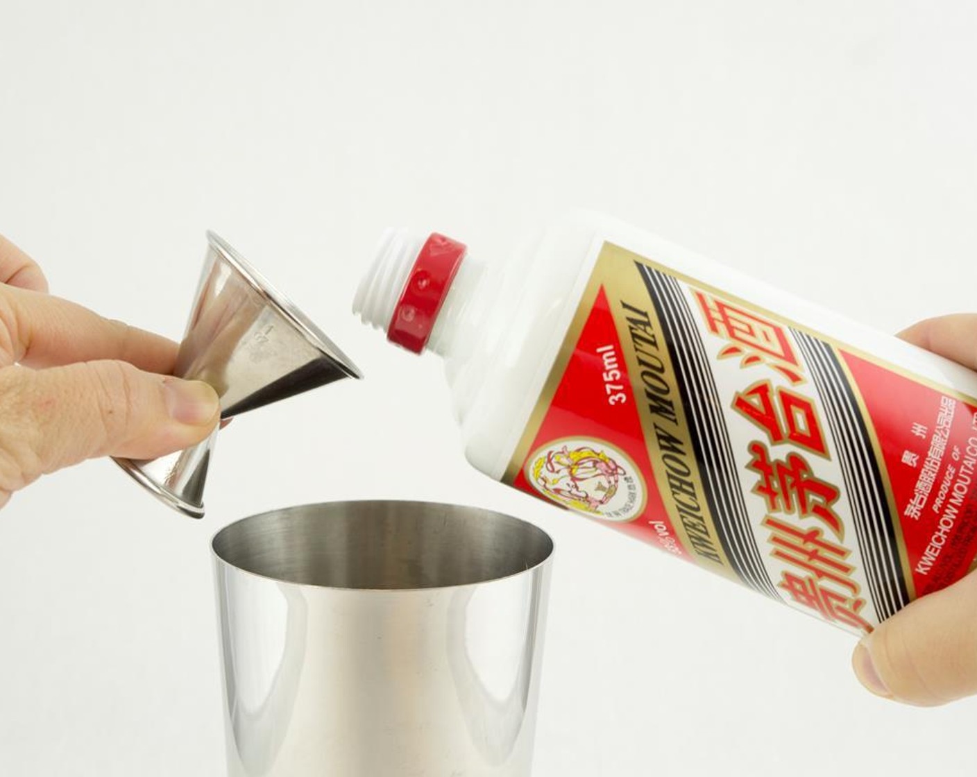 step 2 Fill a martini glass with ice and set it aside. Pour Kweichow Moutai Baijiu (2 fl oz) into a cocktail shaker filled with Ice (as needed).