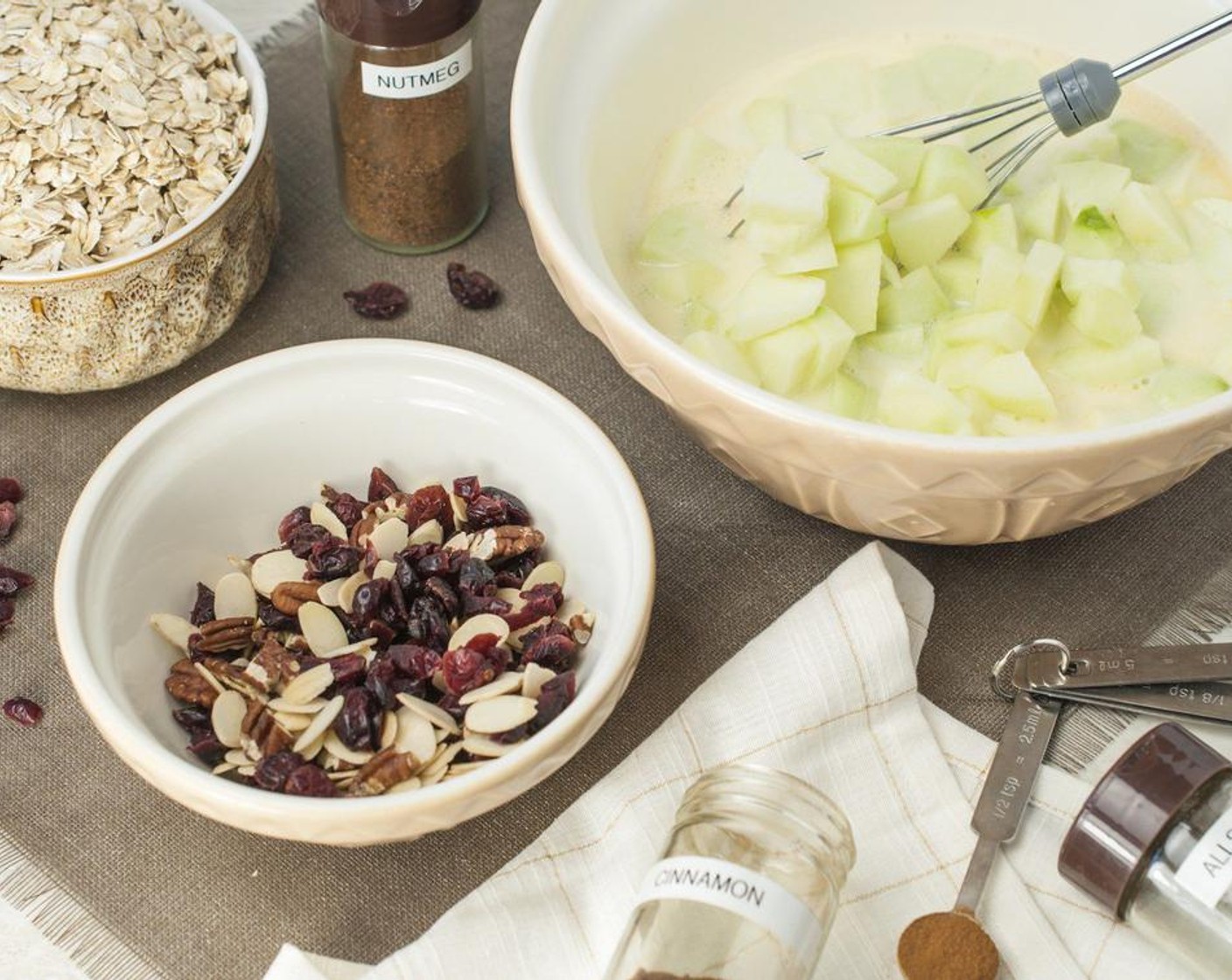 step 4 Whisk in Large Flake Oats (2 cups) and Baking Powder (1 tsp). Stir in Dried Cranberries (1/2 cup) and Assorted Nuts (1/2 cup). Pour into a greased 9x9 or 7x11-inch baking dish.