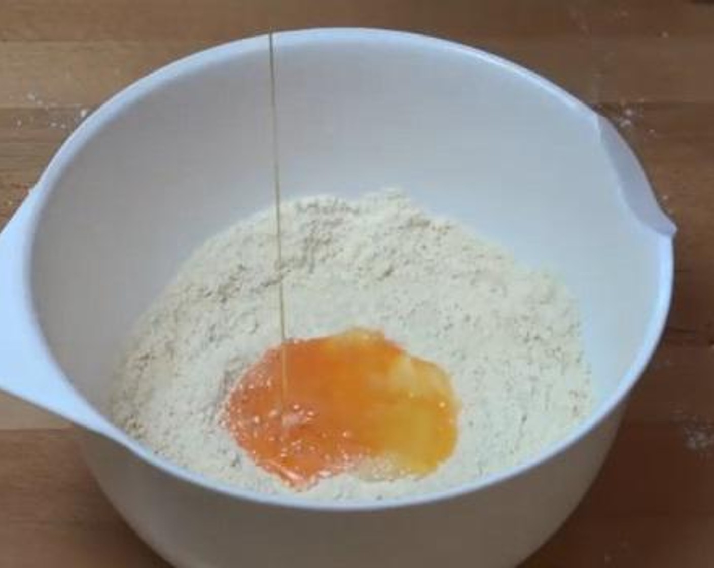 step 1 Into a mixing bowl, add and mix the Self-Rising Flour (1 cup), and Butter (2 Tbsp). Then add in the Salt (1 pinch), Milk (4 Tbsp), and Eggland's Best Classic Egg (1), and combine everything together.
