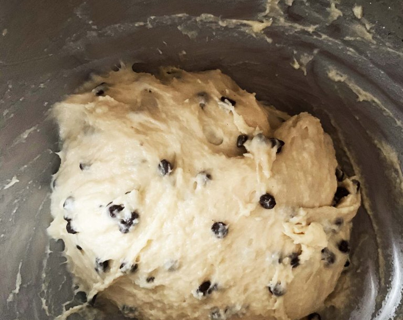 step 4 Now add the Ghee (2 Tbsp), a few pieces at the time, waiting for the first batch to be absorbed before adding more. Next, add the Salt (1/2 tsp) and with your mixer on high speed keep mixing the dough until it gets smooth and elastic. Last add in the Chocolate Chips (to taste). Mix until they are incorporated (if it’s hot, place the chocolate chips in your freezer for a few hours).