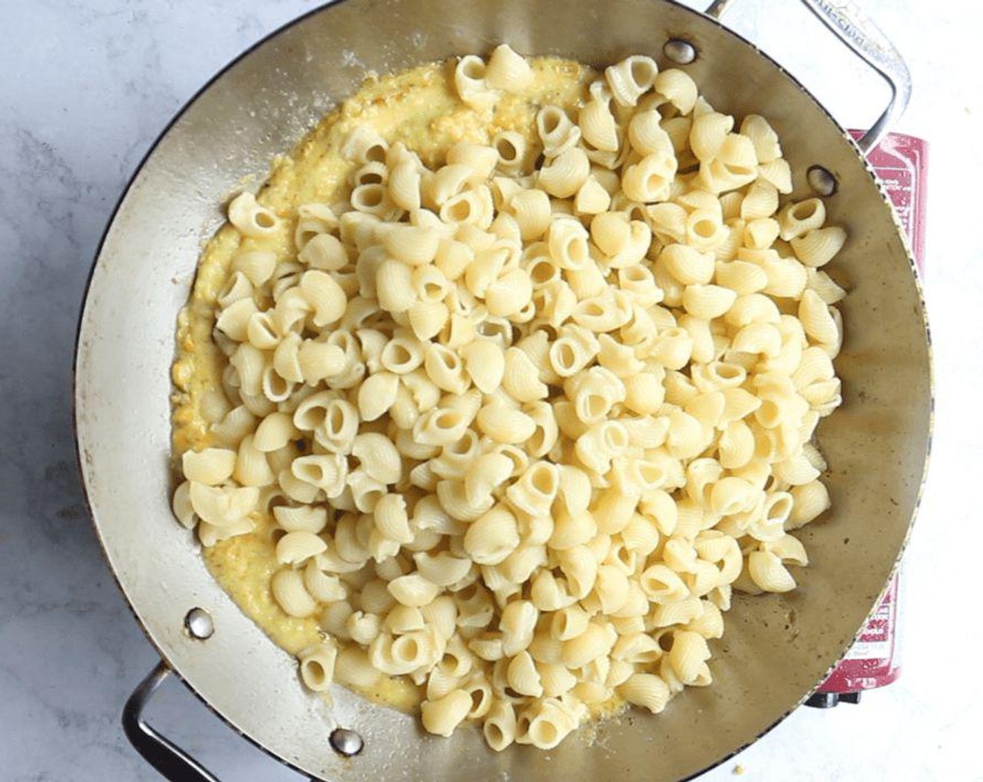 step 6 Reduce heat to medium. Add pasta and 1/4 cup of the reserved pasta cooking water, tossing to coat. Cook for a minute, then add a little more of the pasta cooking water if the mixture seems too thick. Stir in the Grated Parmesan Cheese (1/2 cup), Fresh Basil (1/3 cup), the Crushed Red Pepper Flakes (1 pinch), and Kosher Salt (to taste) and Freshly Ground Black Pepper (to taste).