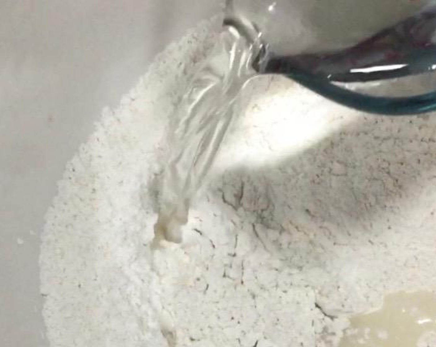 step 1 In a large mixing bowl, mix All-Purpose Flour (1 2/3 cups), Instant Dry Yeast (1 Tbsp), and Granulated Sugar (2/3 cup). Then, add in Water (3/4 cup) and mix well.