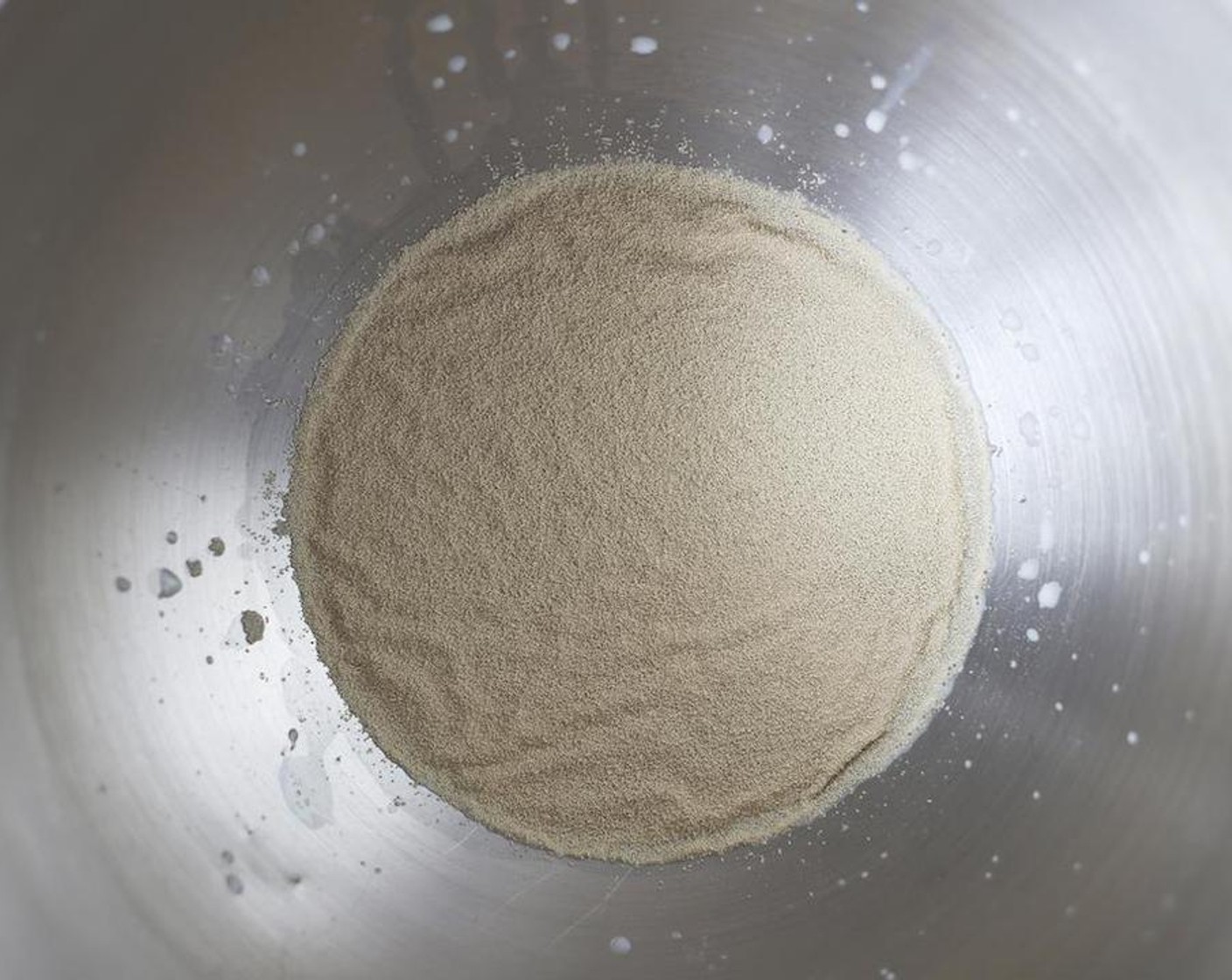 step 3 Sprinkle over the Active Dry Yeast (1/2 Tbsp) and gently stir. Set aside and allow the yeast to activate, around 5 to 10 minutes.