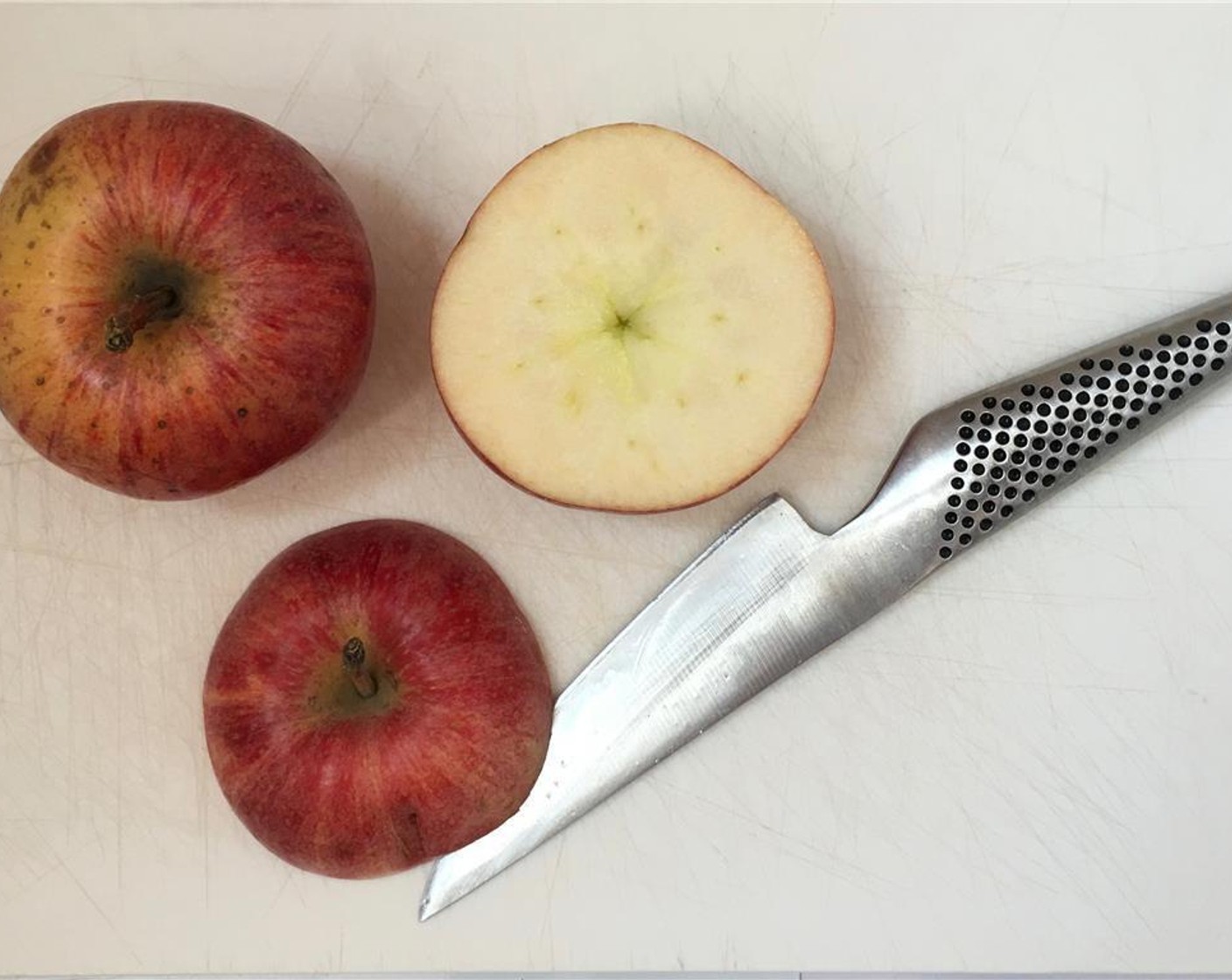 step 2 Slice the Apples (2) in half close to the stems, making 2 apple 'lids'.