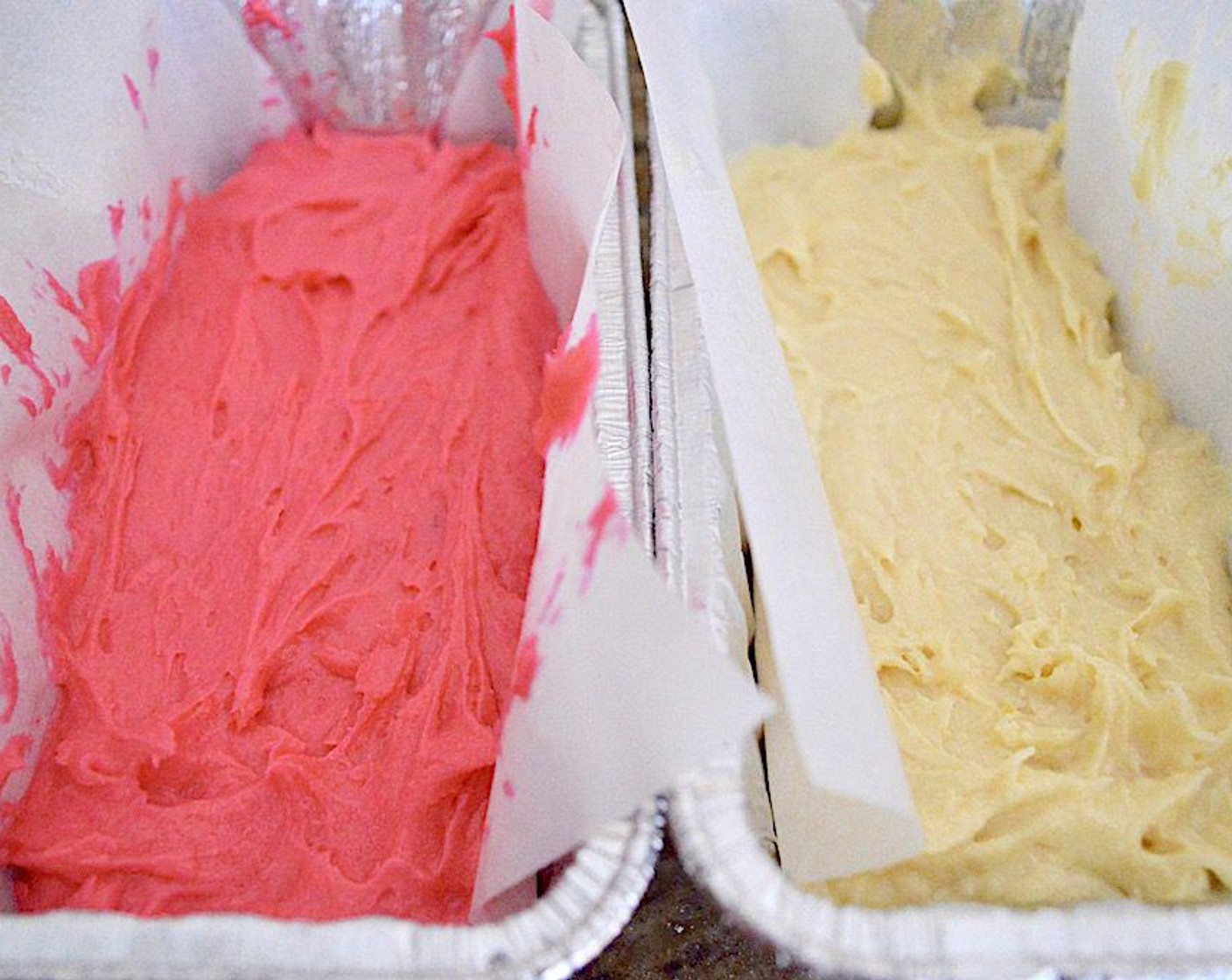 step 4 Divide the batter evenly into two bowls. Use a scale to be really precise ideally. Stir the Rose Water (1/2 tsp) and Pink Gel Food Coloring (1/4 tsp) into one of the bowls, and the Lemon (1) zest and juice into the other bowl. Now you have two separate, gorgeously flavored batter.