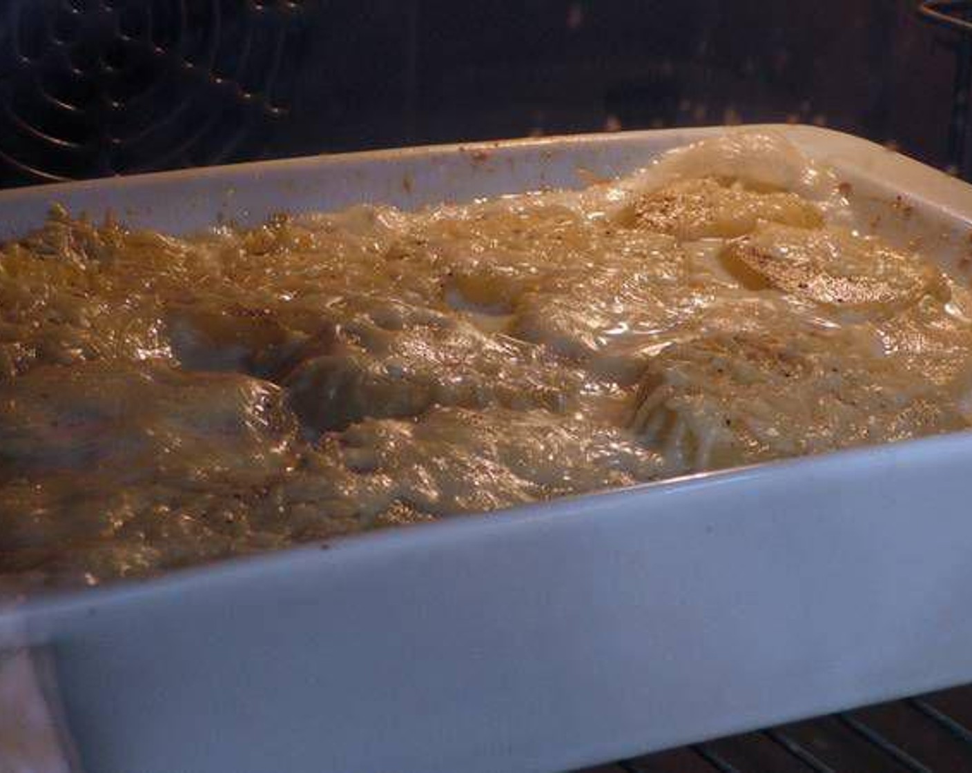 step 6 Place the baking tray in the preheated oven for 45 minutes. If the top does not look golden and bubbly, raise the baking tray to the top rack of your oven for another 5 minutes.