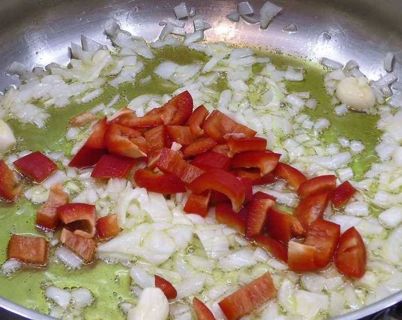 step 1 In a large pan add enough Olive Oil (as needed) to cover the bottom and season with a bit of Salt (to taste). Add the Onion (1) and Garlic (4 cloves). Once the onion becomes translucent, add in the Carrot (1) and Assorted Color Bell Peppers (to taste).