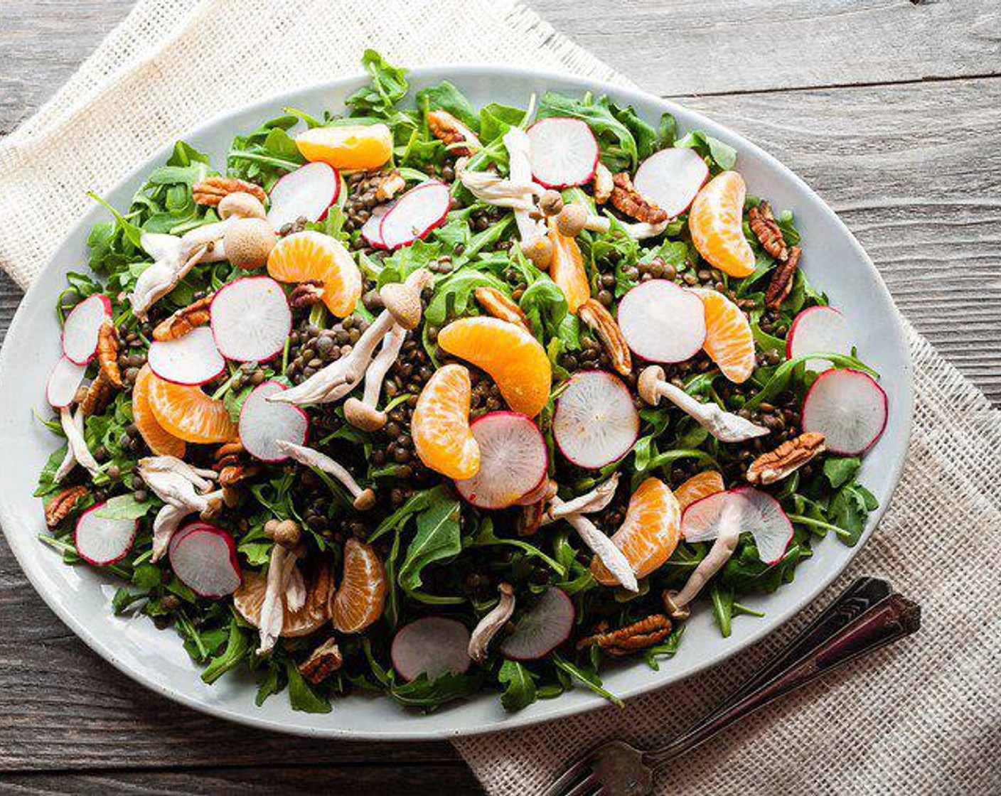 step 5 Combine lentils, Arugula (1 bunch), Radish (1 cup), Beech Mushrooms (1 1/2 cups), Clementines (3), and Pecans (1/2 cup). Dress immediately before serving. Enjoy!