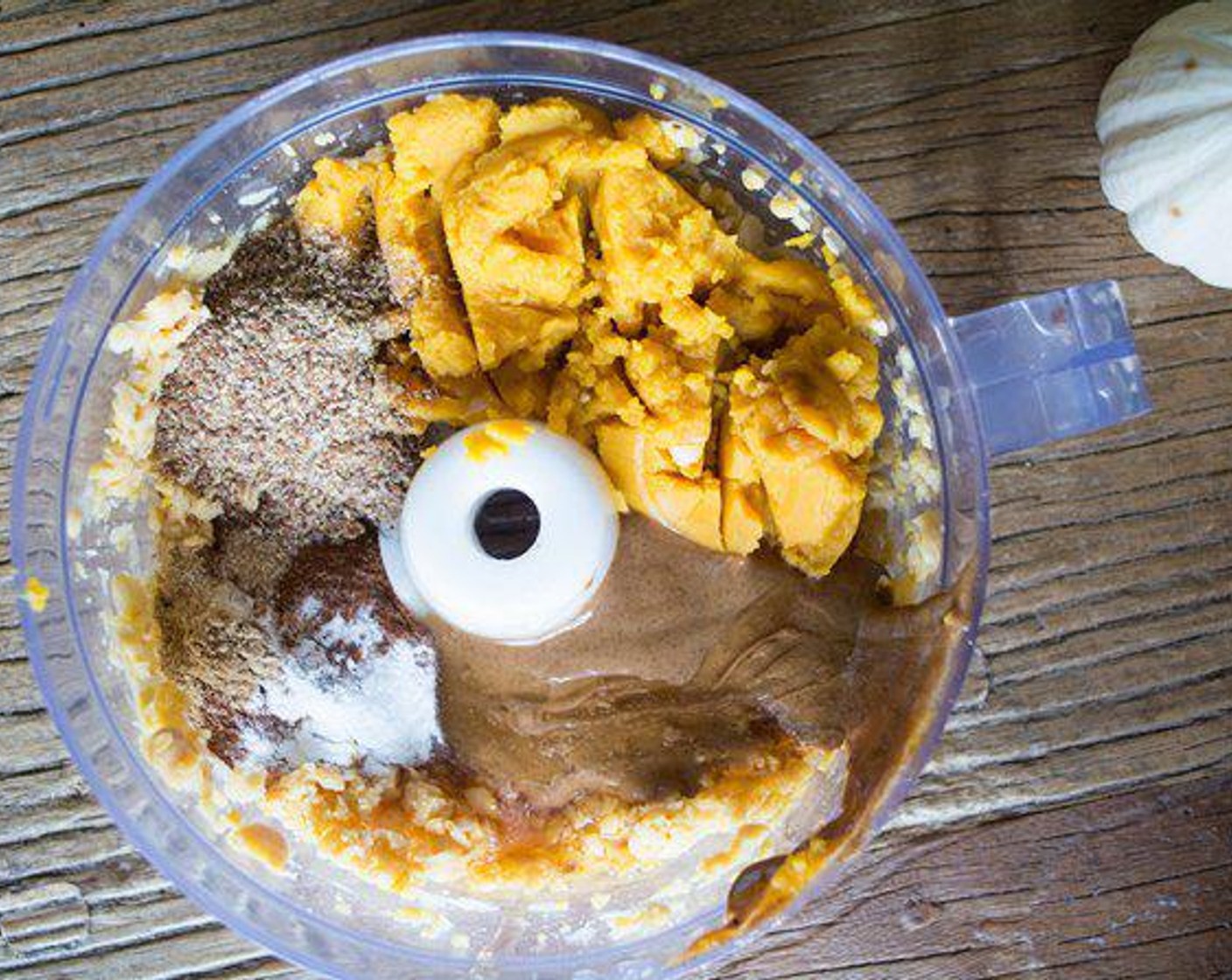 step 2 Add the Canned Pumpkin Purée (1 cup), Almond Butter (4 Tbsp), Honey (1/2 cup), Flaxseed Meal (2 Tbsp), Vanilla Extract (1 tsp), Simply Organic Cinnamon, Ground (1 tsp), Baking Powder (1/2 tsp), Baking Soda (1/2 tsp), Ground Ginger (1/2 tsp), Salt (1/2 tsp), all but the chocolate chips, and process until smooth.