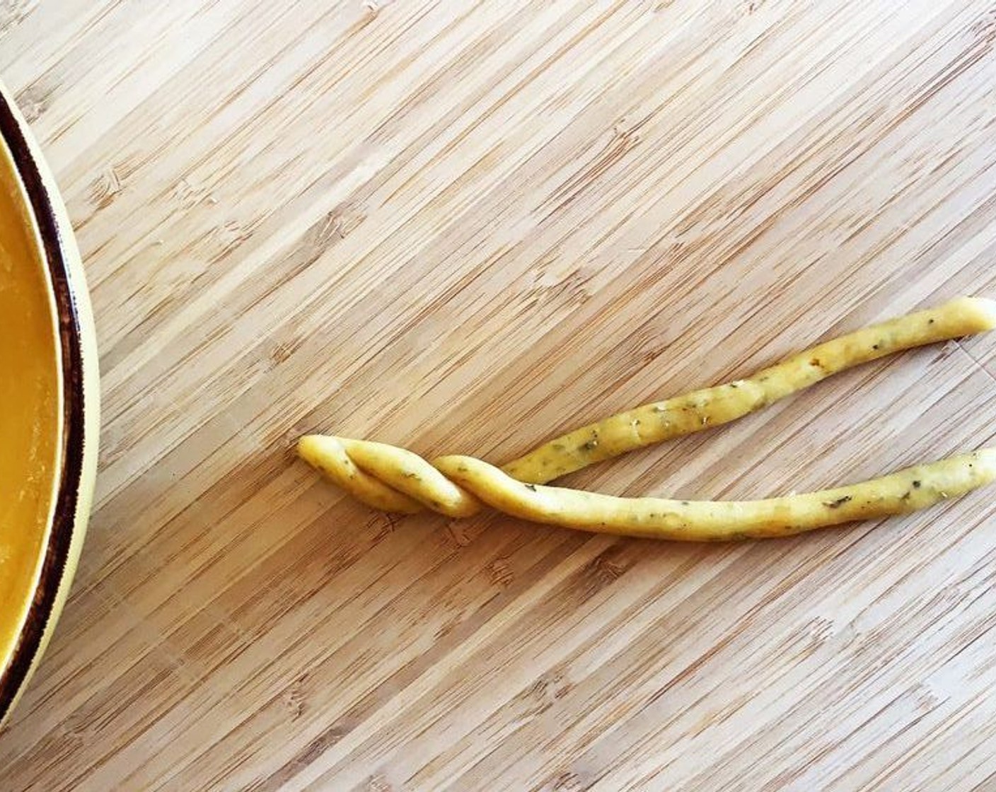 step 4 Divide the dough into 12 equally sized balls, roll them into ropes and cross 2 of them together.