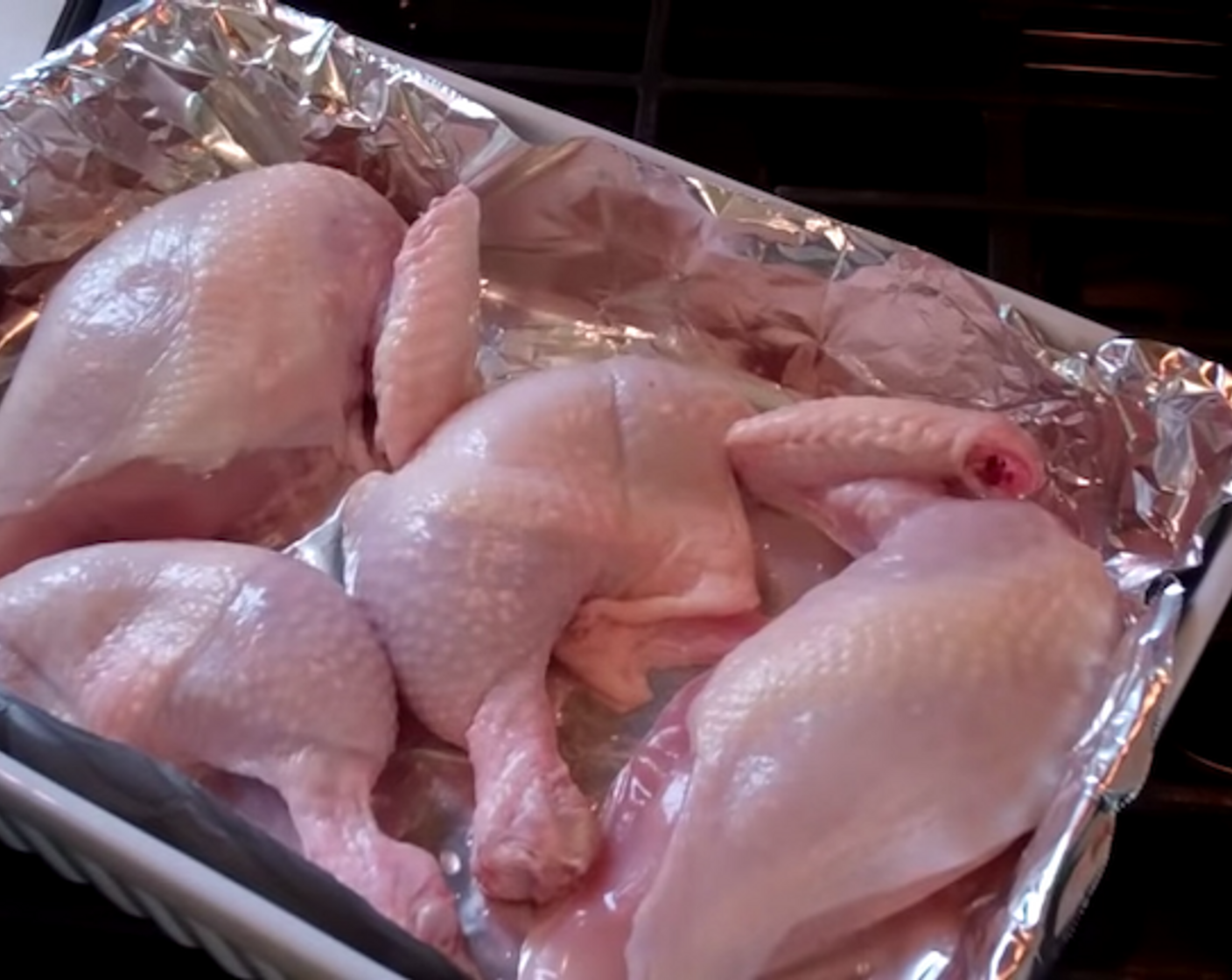 step 2 Cut the Chicken (1) into four pieces. Trim off the fat and excess skin. Wash the chicken pieces with juice from the Lime (1) then rinse with cool water. Pat dry and get ready to season.