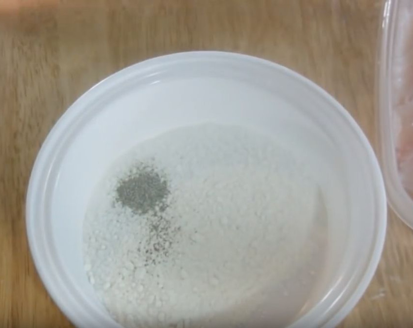 step 1 Into a mixing bowl, add the All-Purpose Flour (1/2 cup) and Ground Black Pepper (1/2 tsp). Mix to combine.