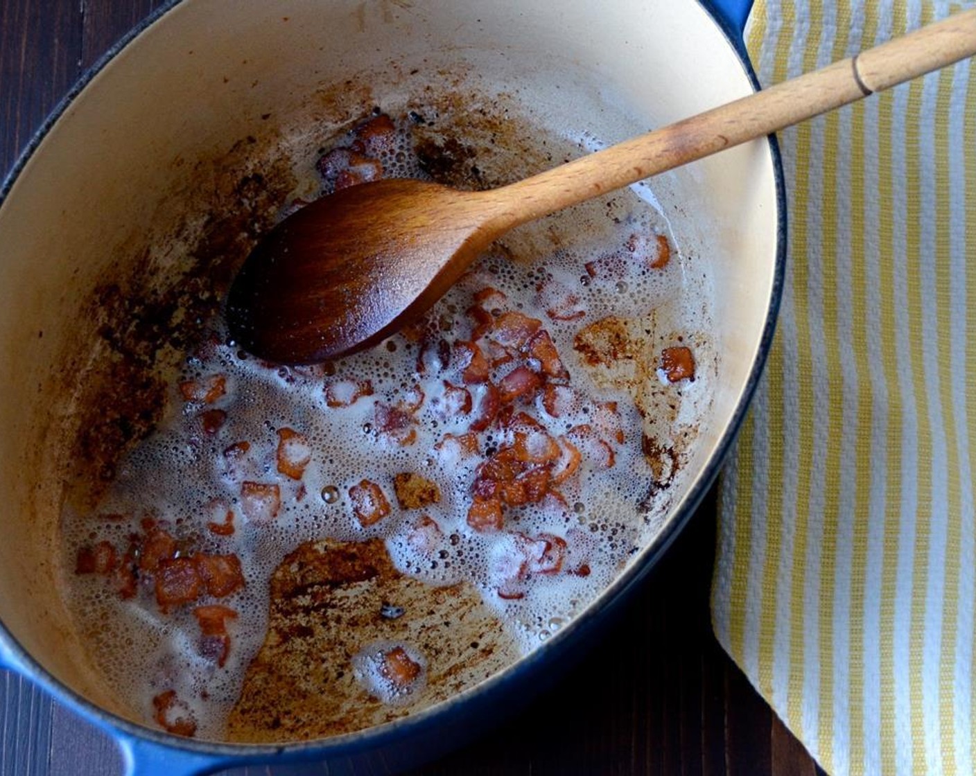 step 3 Place a dutch oven or heavy pot on medium high heat. Add the bacon and cook, stirring occasionally, until golden and crisp. Transfer the bacon to a paper towel to drain. Discard all but one tablespoon of the bacon grease.