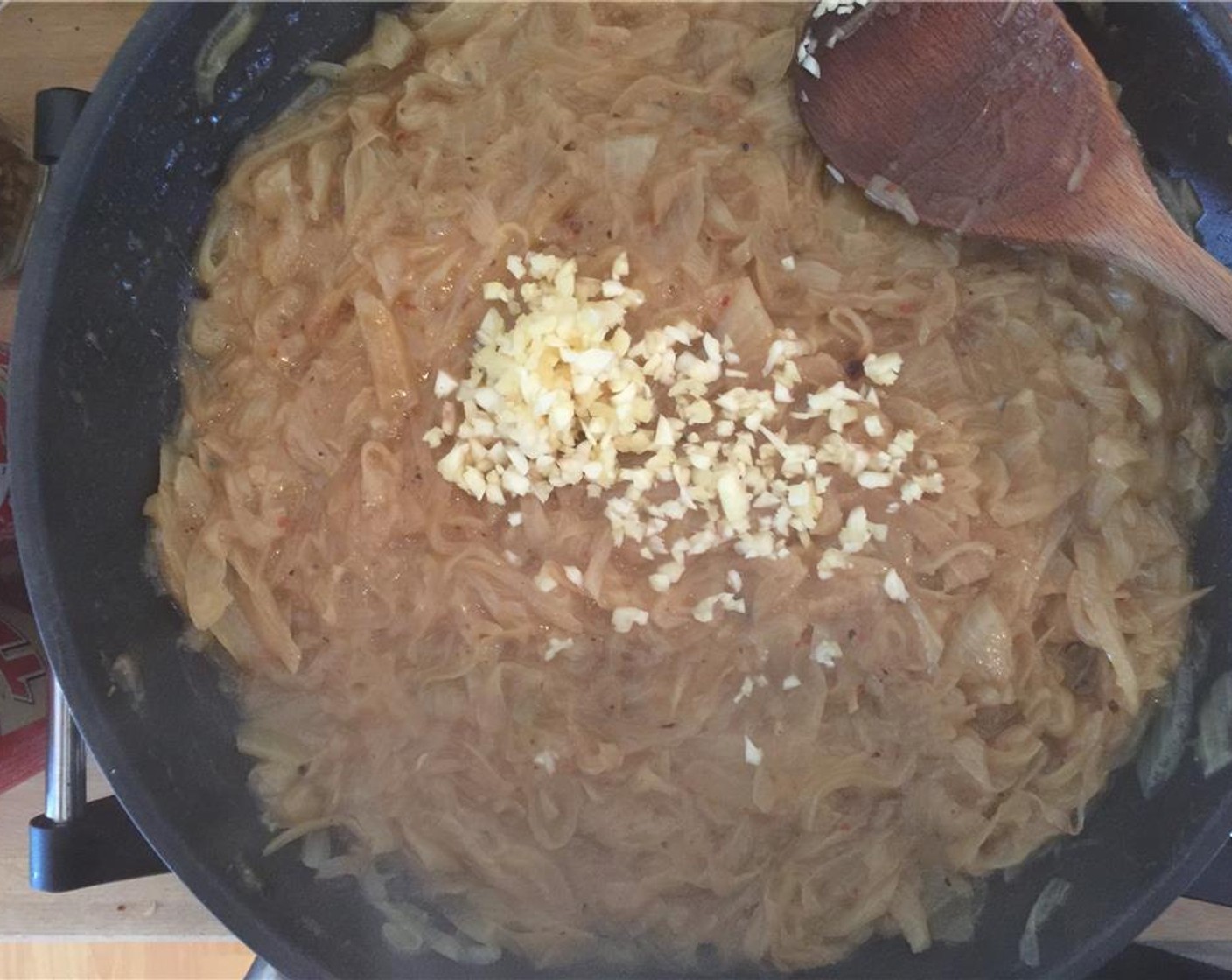 step 8 When the onions are looking good add the minced garlic and a good pinch of Crushed Red Pepper Flakes (to taste). Once you can smell the garlic, it's time to add the beer.