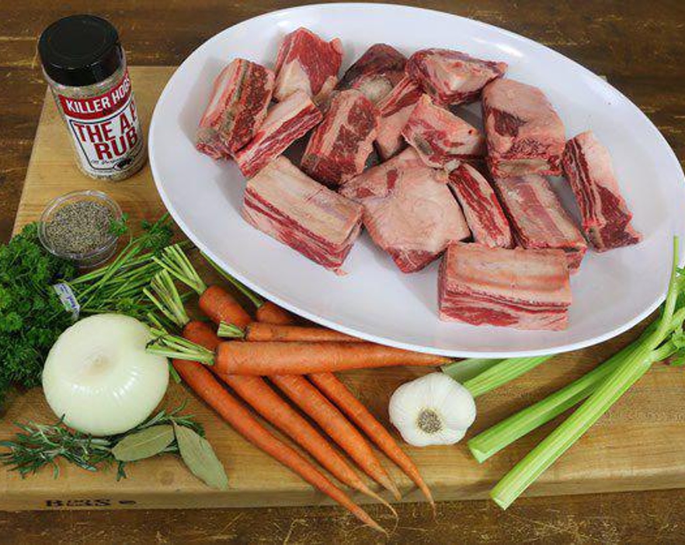 step 3 Chop Carrots (3), Celery (3 stalks), and Onion (1) into large chunks. Place in a full size steam pan. Smash Garlic (8 cloves) and add to pan. Pour in Beef Stock (4 cups) and Red Wine (2 cups). Add Tomato Paste (2/3 cup) and stir to disperse. Season with All-Purpose Spice Rub (1/4 cup) and add Fresh Rosemary (2 sprigs) and Bay Leaf (1).