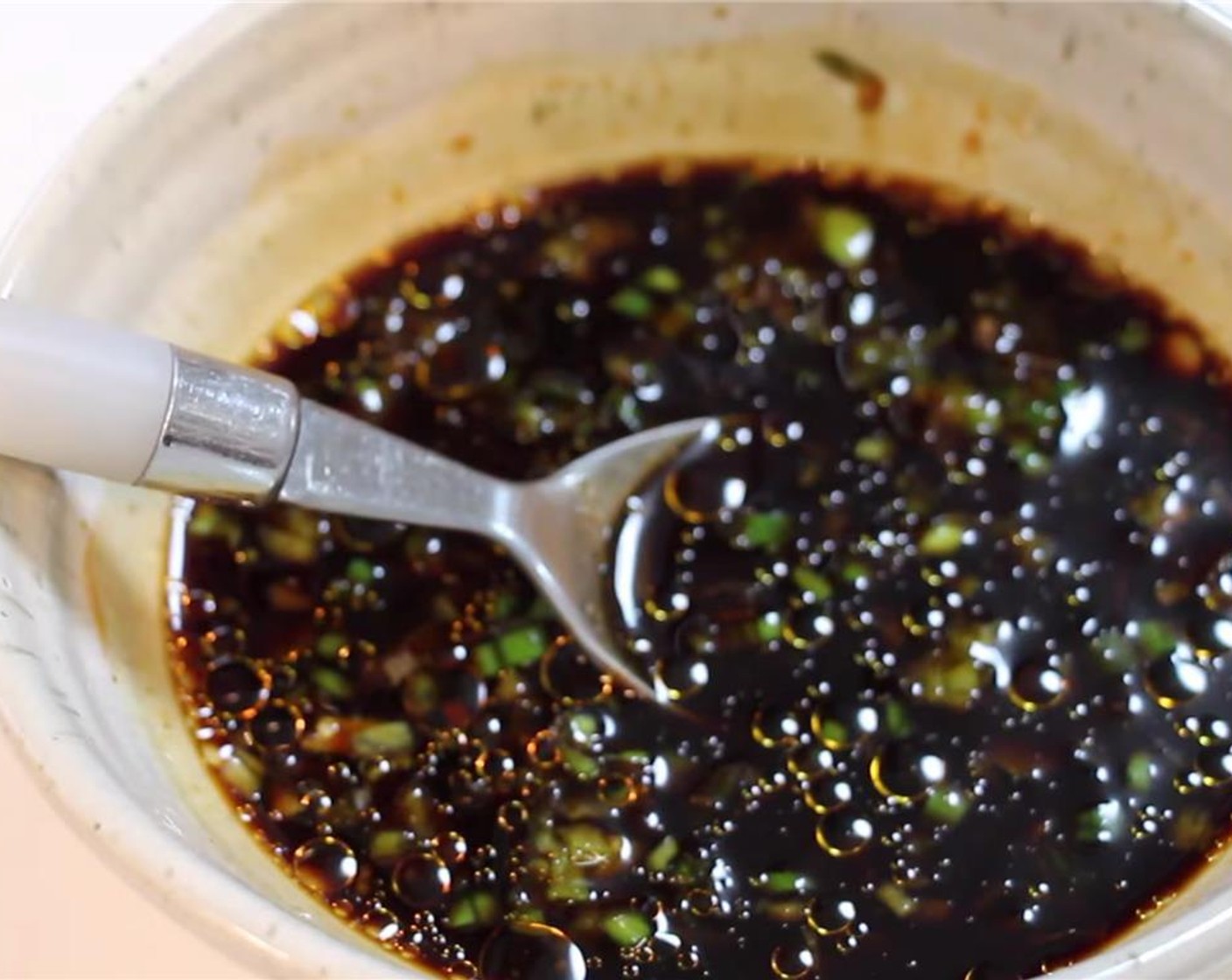 step 9 Mince a Scallion (1 Tbsp). Add Soy Sauce (1/3 cup), Hoisin Sauce (1 tsp), Granulated Sugar (1 1/2 Tbsp), Chili Garlic Sauce (1 tsp), Distilled White Vinegar (2 Tbsp), and Sesame Oil (1 tsp). Mix well and set aside.