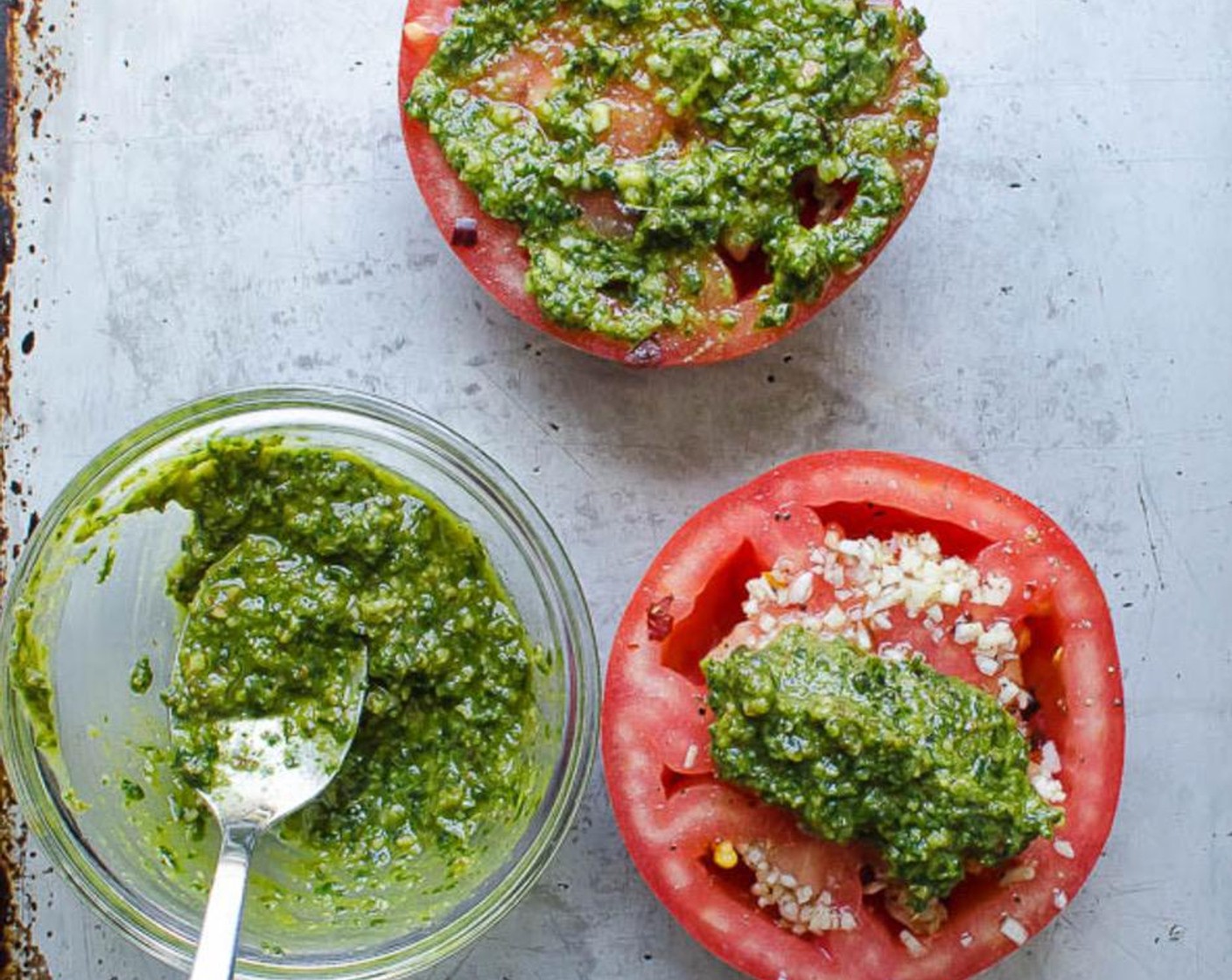step 4 Add 1 tablespoon of Basil Pesto (4 Tbsp) to each tomato half and spread evenly over the tomato. Divide the Breadcrumbs (1/2 cup) between the tomatoes.