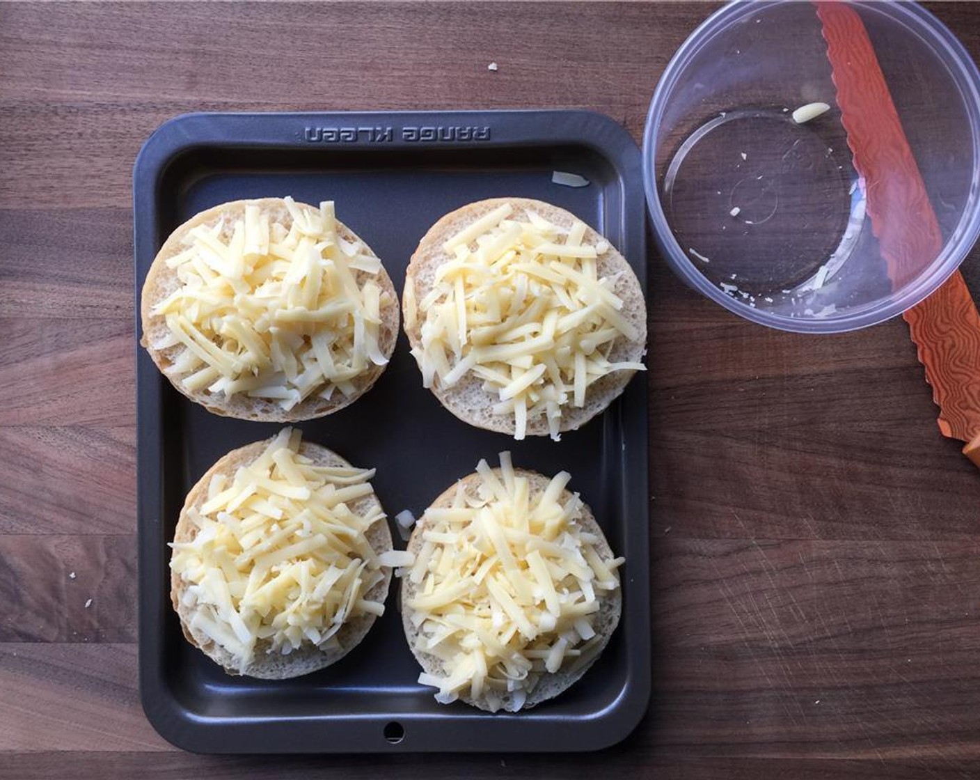 step 13 Slice the Sourdough Rolls (4) in half and top with cheese. Set aside. Preheat your broiler.