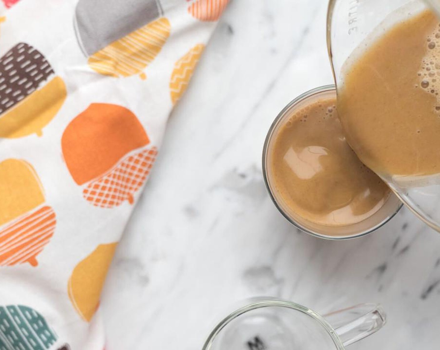 step 2 Once warmed, pour into a blender and add Canned Pumpkin Purée (1/4 cup), Ground Cinnamon (1 tsp), Ground Ginger (1 tsp), Ground Nutmeg (1/4 tsp) and Maple Syrup (2 Tbsp). Blend until fully combined.