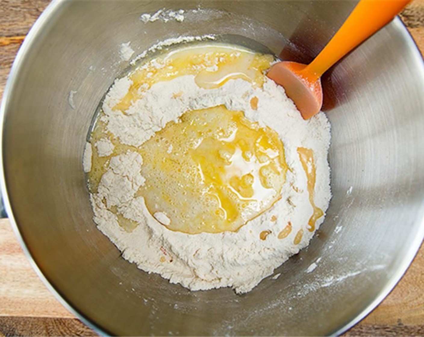 step 4 Make a well in the center of dry ingredients and pour the wet mixture in the well. Stir until thoroughly combined.