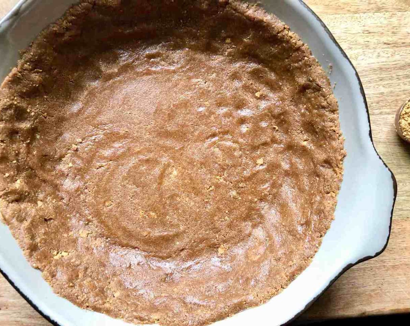 step 4 Press crumb mixture into bottom and up the sides of the 9-inch prepared pie plate.