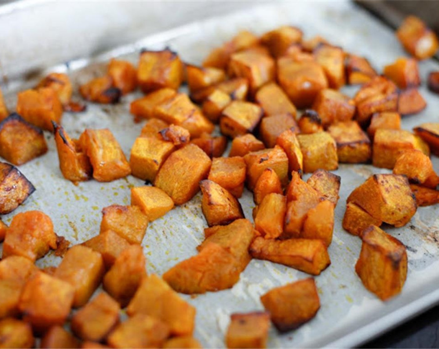 step 3 Peel and dice the Pumpkins (8 2/3 cups) place on a lined baking tray with a drizzle of Extra-Virgin Olive Oil (as needed) in the oven for 15 minutes, then turn for another 10 minutes until golden brown.