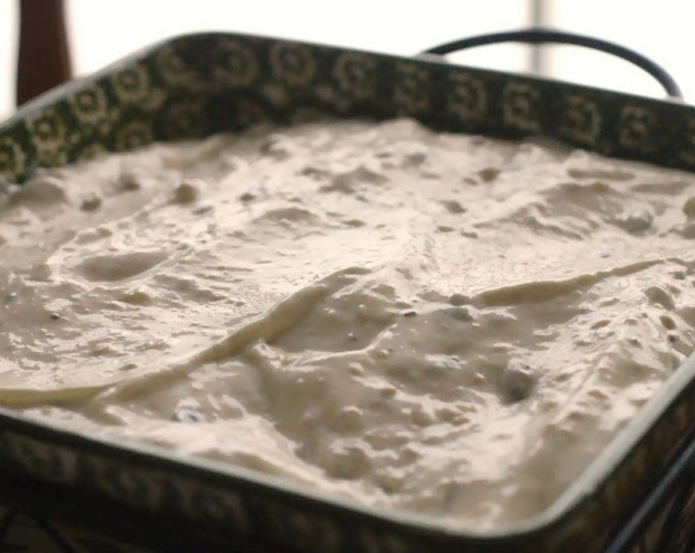 step 4 In a small bowl, mix together Sour Cream (1 cup) and Cream of Chicken Soup (10.5 oz). Spread mixture over casserole.