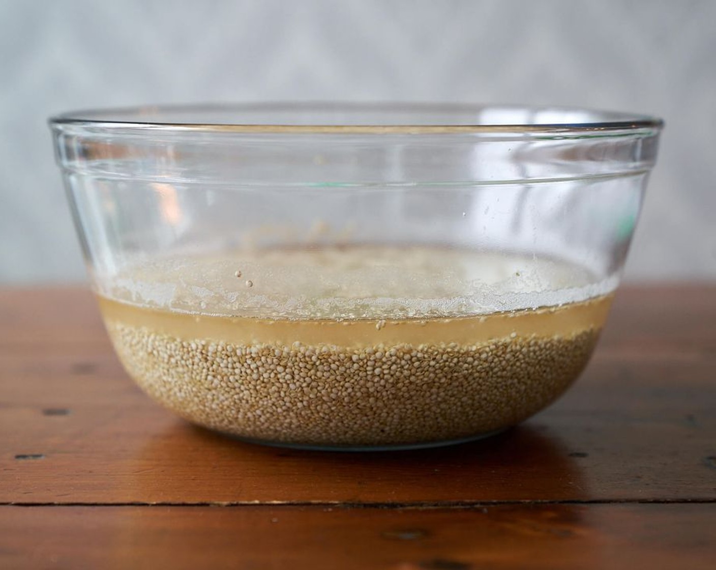 step 1 Place the Quinoa (2 1/2 cups) in a large bowl. Add enough water to cover the quinoa and let sit overnight or at least 8 hours. After 8 hours, drain the water and rinse the quinoa thoroughly with a wire mesh strainer, or pour it into a nutbag to rinse. Do not skip this step even if you are using 'pre-rinsed' quinoa. It won't work unless it's soaked for a long time to absorb water and soften.