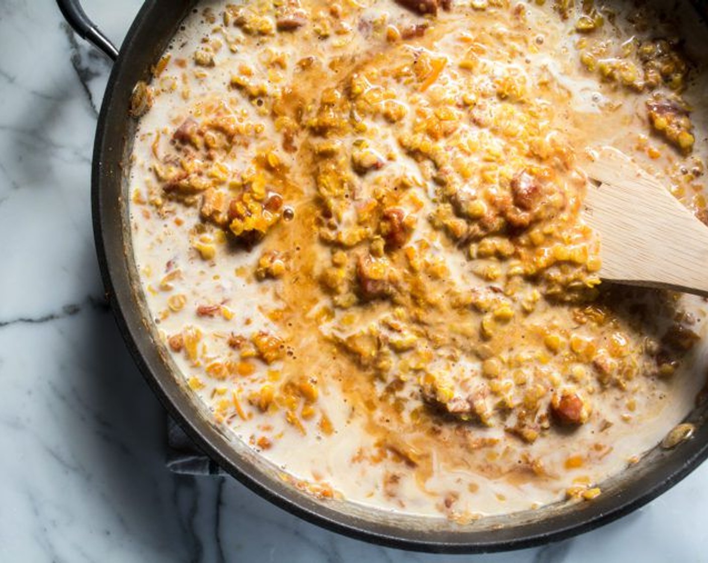 step 12 Once lentils are tender, stir in Coconut Milk (1 can) and sweet potato, and stir until well combined. Cook until mixture is heated through.