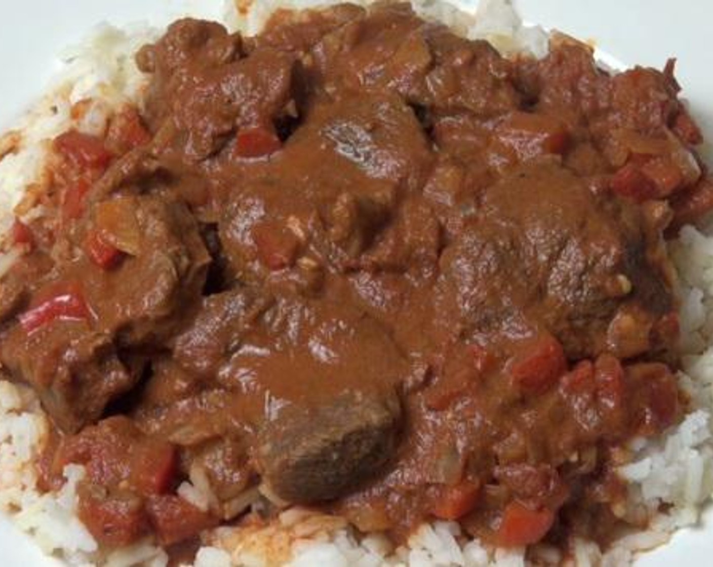 step 2 Add in the Sour Cream (4 Tbsp), and give the mixture a gentle stir. Serve with the White Rice (to taste).