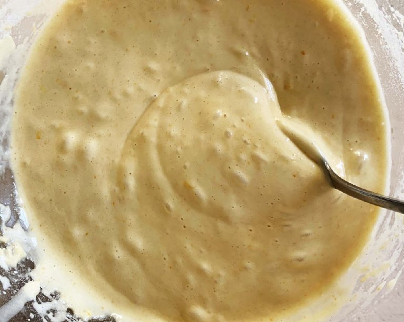 step 3 While still whisking slowly pour in the Vegetable Oil (2 oz). Next, sift in the Type 00 Flour (1 1/2 cups) a Tbsp at a time and Baking Powder (1 Tbsp) alternating with the Orange Juice.