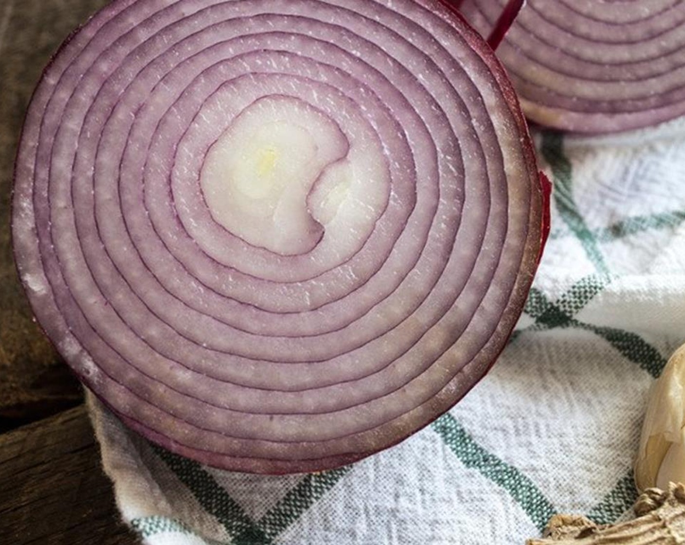 step 4 Meanwhile, add Coconut Oil (1/2 Tbsp), Red Onion (1), and Garlic (2 cloves) to large saucepan, cook over medium heat for 3 to 5 minutes.