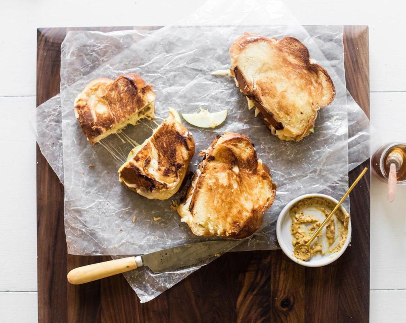 step 5 To grill, place a large pan over medium-low heat and coat the bottom of the pan with Butter (to taste). Fry the sandwiches for about 1-2 minutes on each side, adding more butter as needed.