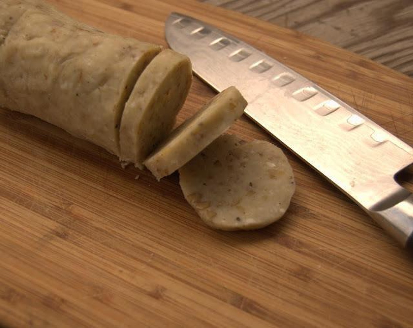 step 4 Slice dough into discs of 1/8 to 1/4-inch. Place on the parchment-lined baking sheet and bake for about 20 minutes or until golden brown. Transfer to a rack to cool.