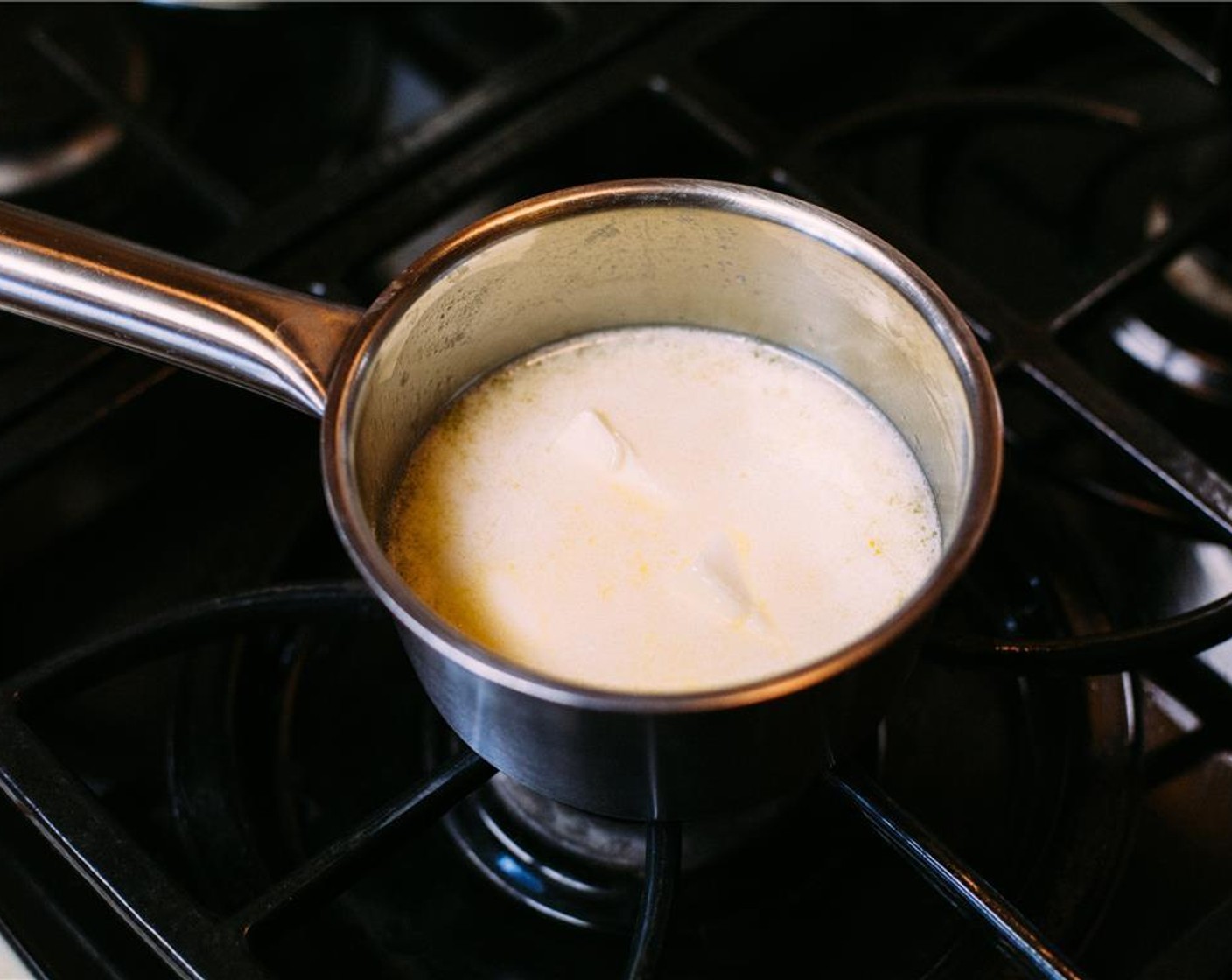 step 1 Place Unsalted Butter (1 cup) in a saucepan and set over low heat, until just half is melted. Cool for 5 minutes, while you prepare the dry ingredients.