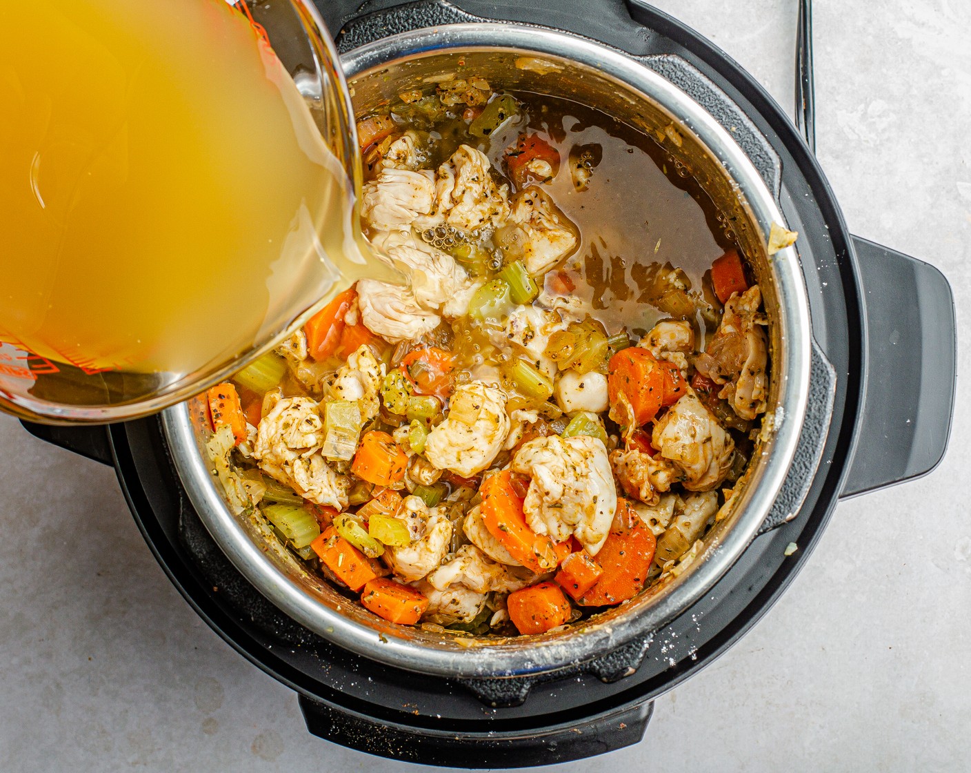 step 3 Turn off the Instant Pot, stir in the Boneless, Skinless Chicken Breast (1 lb), Chicken Stock (2 1/2 cups), and Hot Sauce (1 Tbsp), and scrape the bottom of the pot to get up any brown bits.