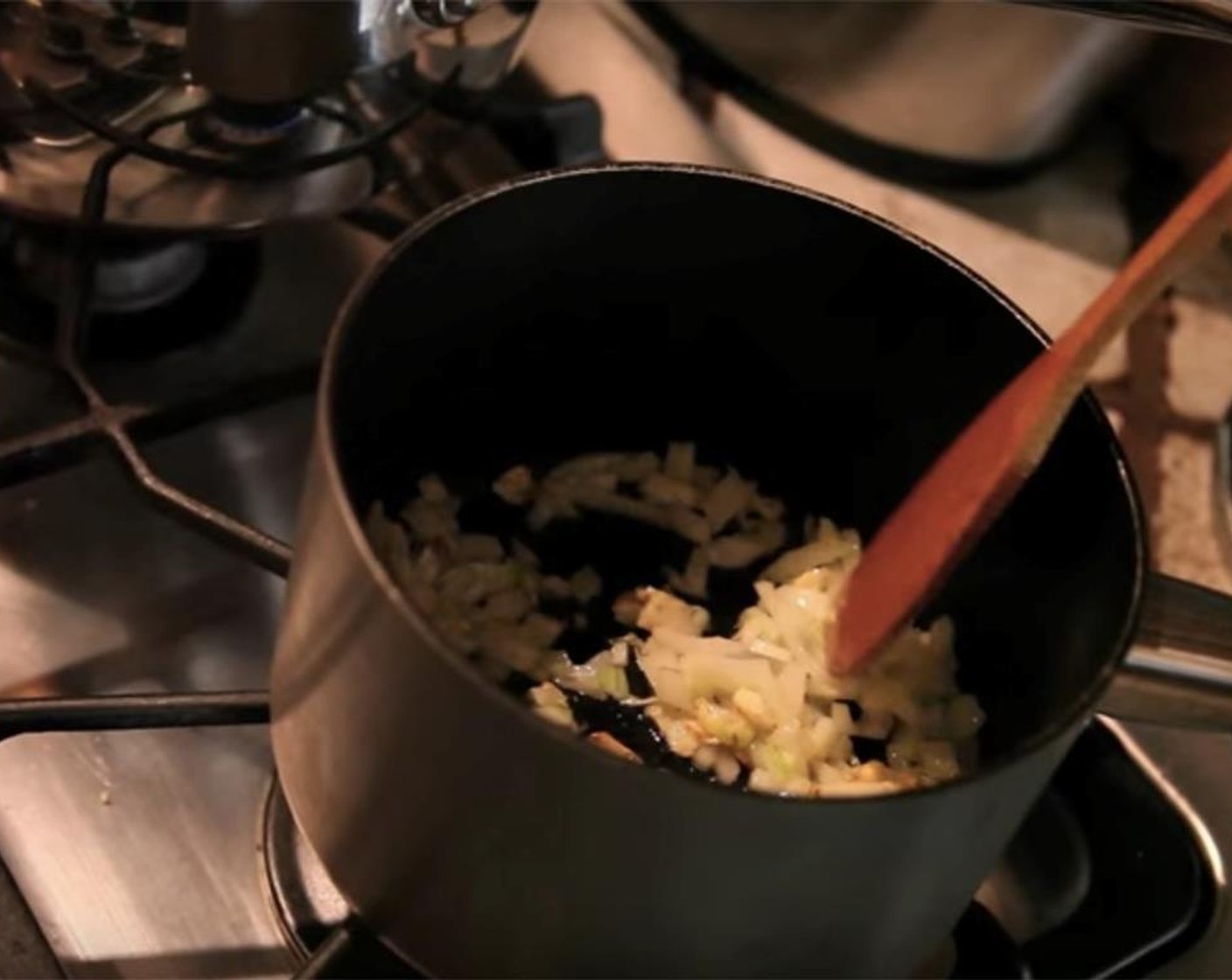 step 2 Preheat a pot over medium heat. Sauté the Onion (1) with Coconut Oil (1 Tbsp) until translucent, about four minutes.