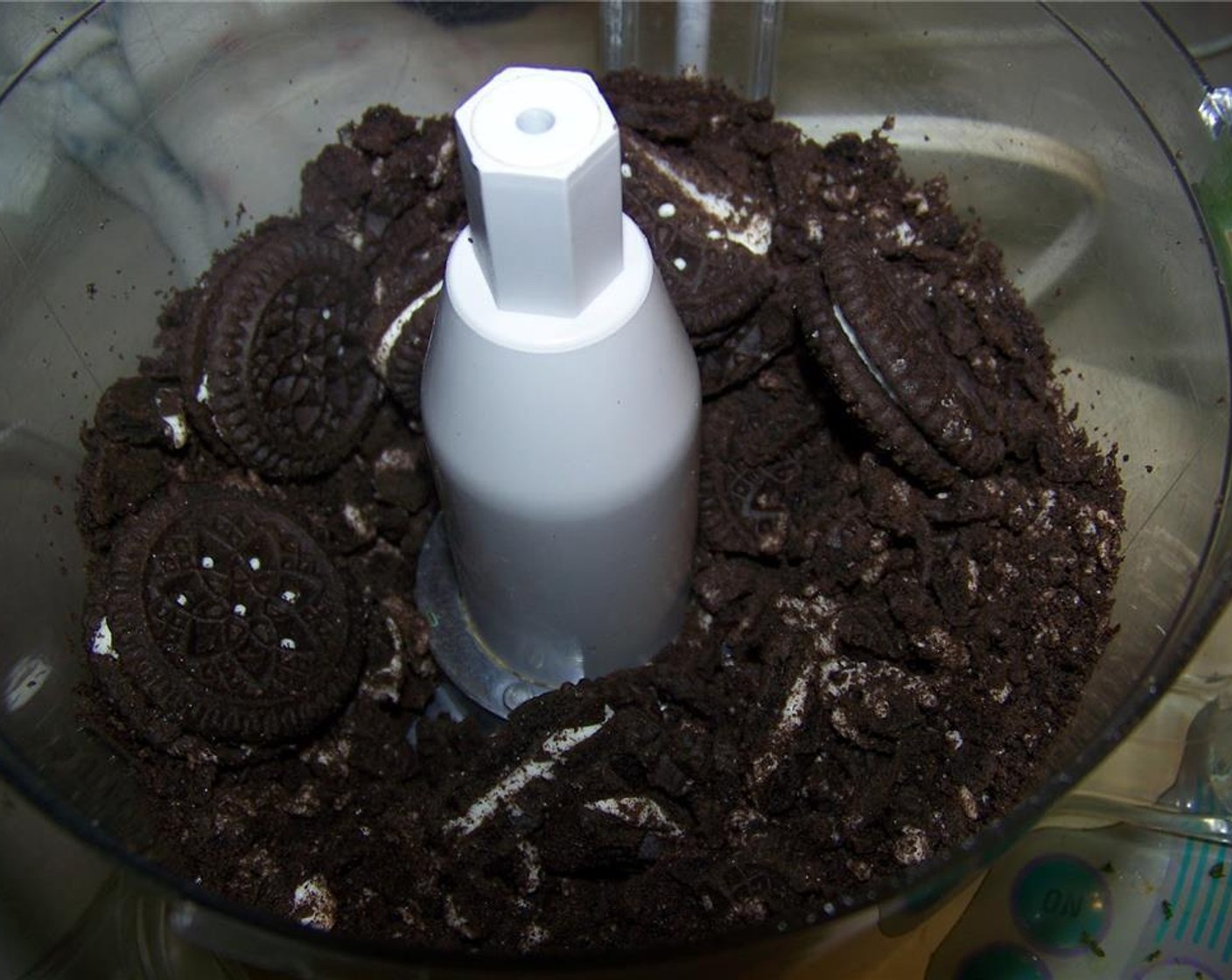 step 2 Crush the Oreo® Chocolate Sandwich Cookies (1 pckg) in a food processor.