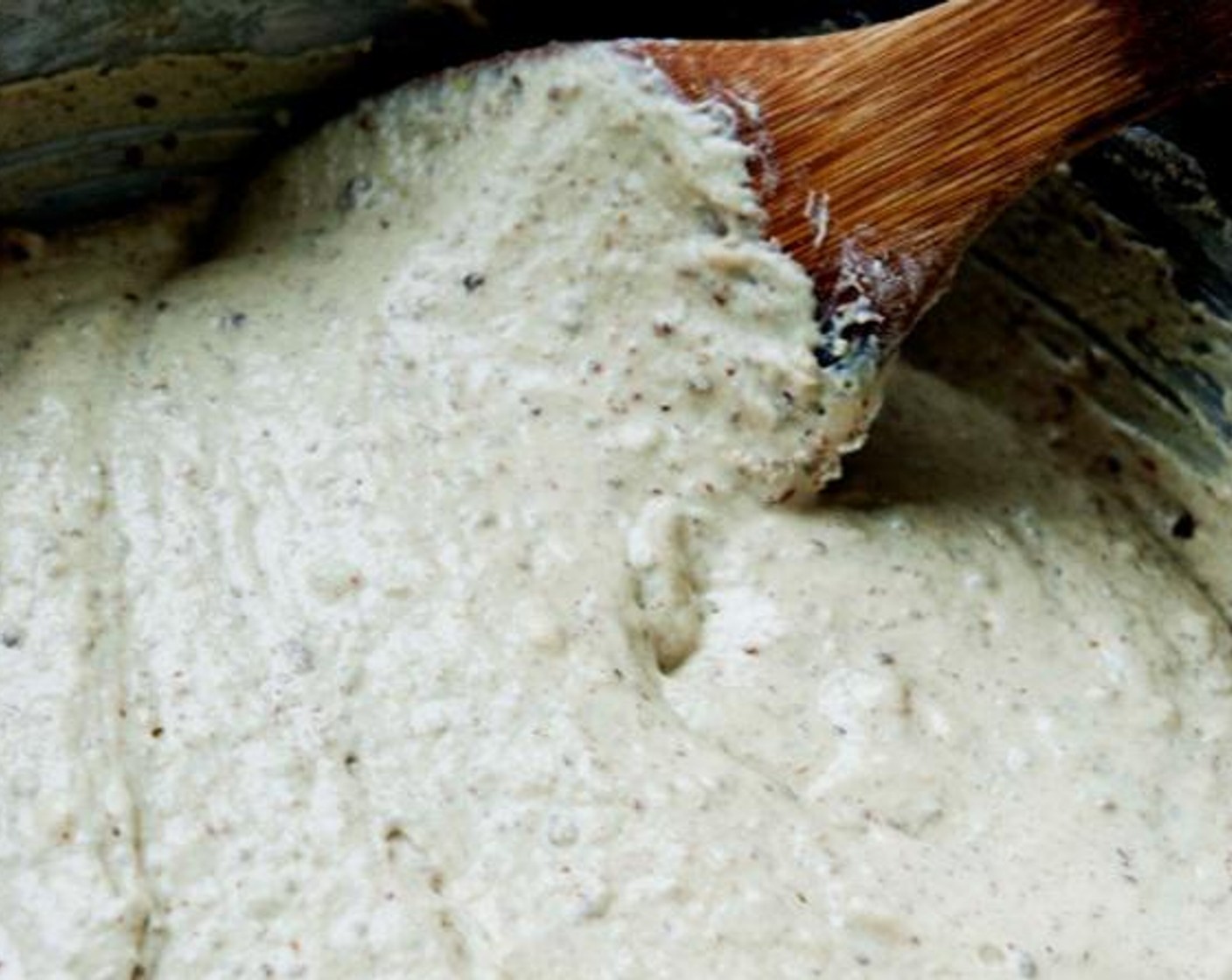 step 4 Pour the yeast mixture into the bowl and stir with a wooden spoon until just combined.