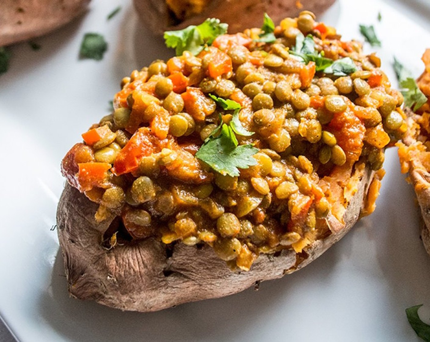 step 8 Top each sweet potato with lentil curry mixture.