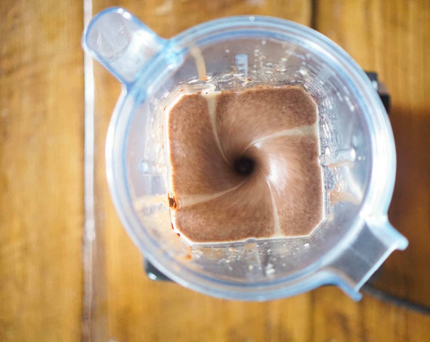 step 12 Add the coconut/cocoa mix to a blender with the Bananas (3) and Almond Milk (1/2 cup). Blend until smooth, about 1-2 minutes.